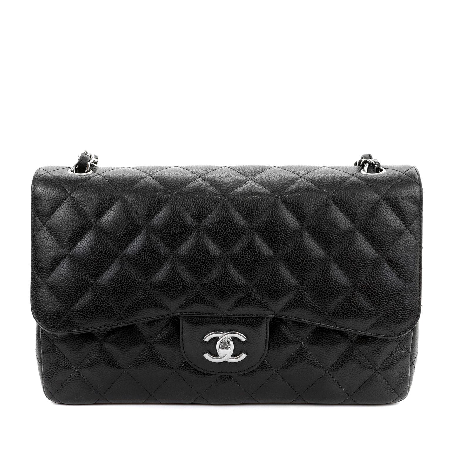 This authentic Chanel Black Caviar Jumbo Classic Flap Bag is in pristine condition.  A key piece in any sophisticated wardrobe, the Classic Flap is one of the most sought-after Chanel styles produced.

Durable and textured black caviar leather is