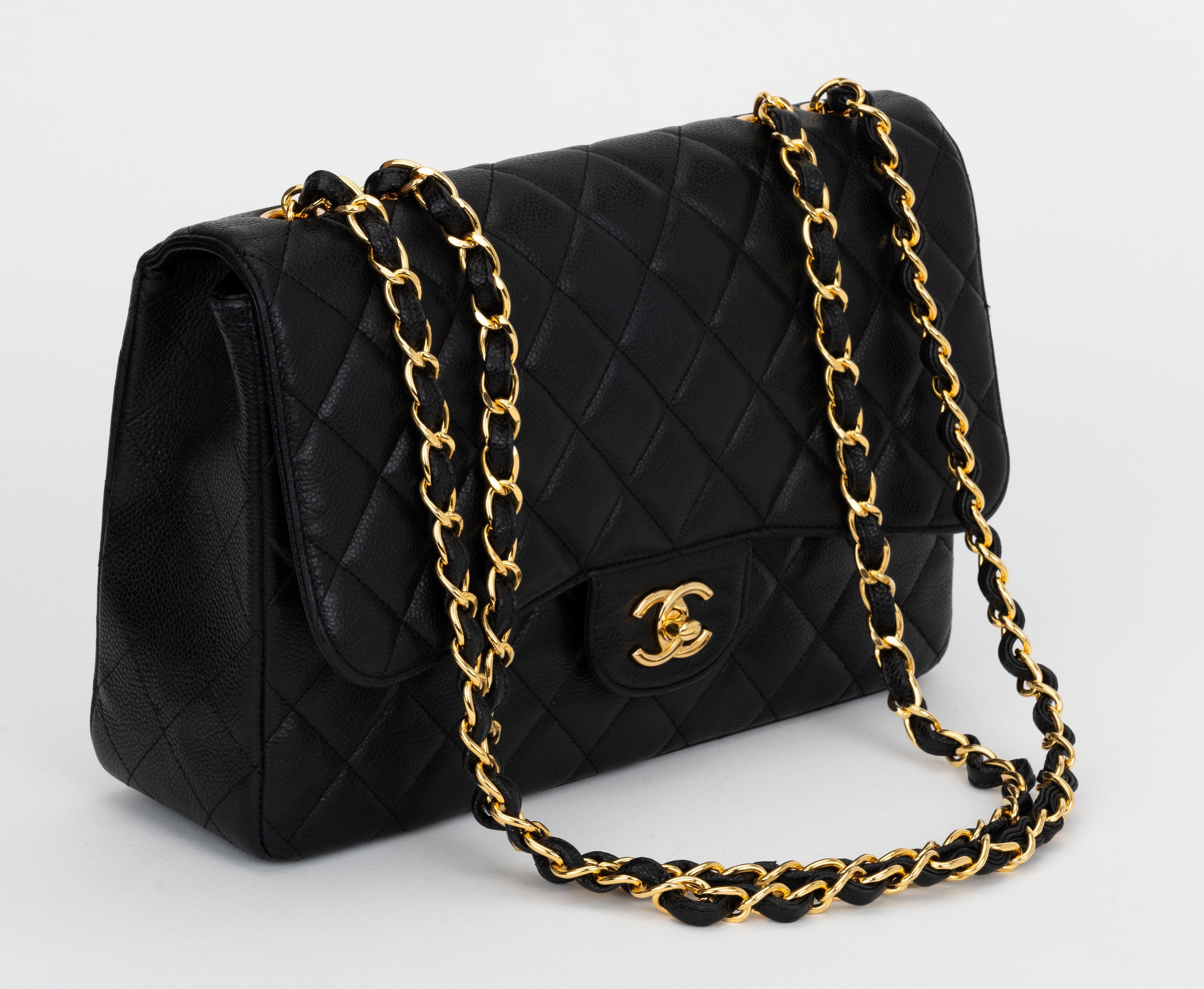 Chanel black caviar leather quilted jumbo single-flap bag.  Gold tone hardware. Shoulder drop, 14