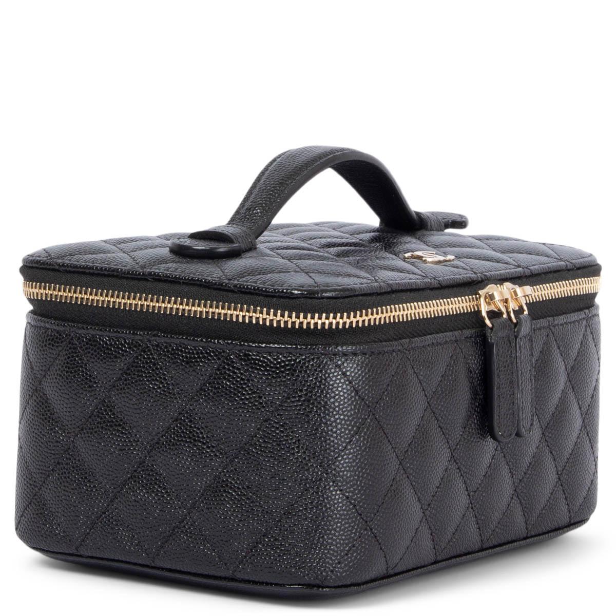 100% authentic Chanel 2020 jewellery case in black caviar leather featuring light gold-tone hardware. Keeps jewellery well organized in black soft alcantara with a soft roll for watches, protection for rings and earrings. Brand new. Comes with dust