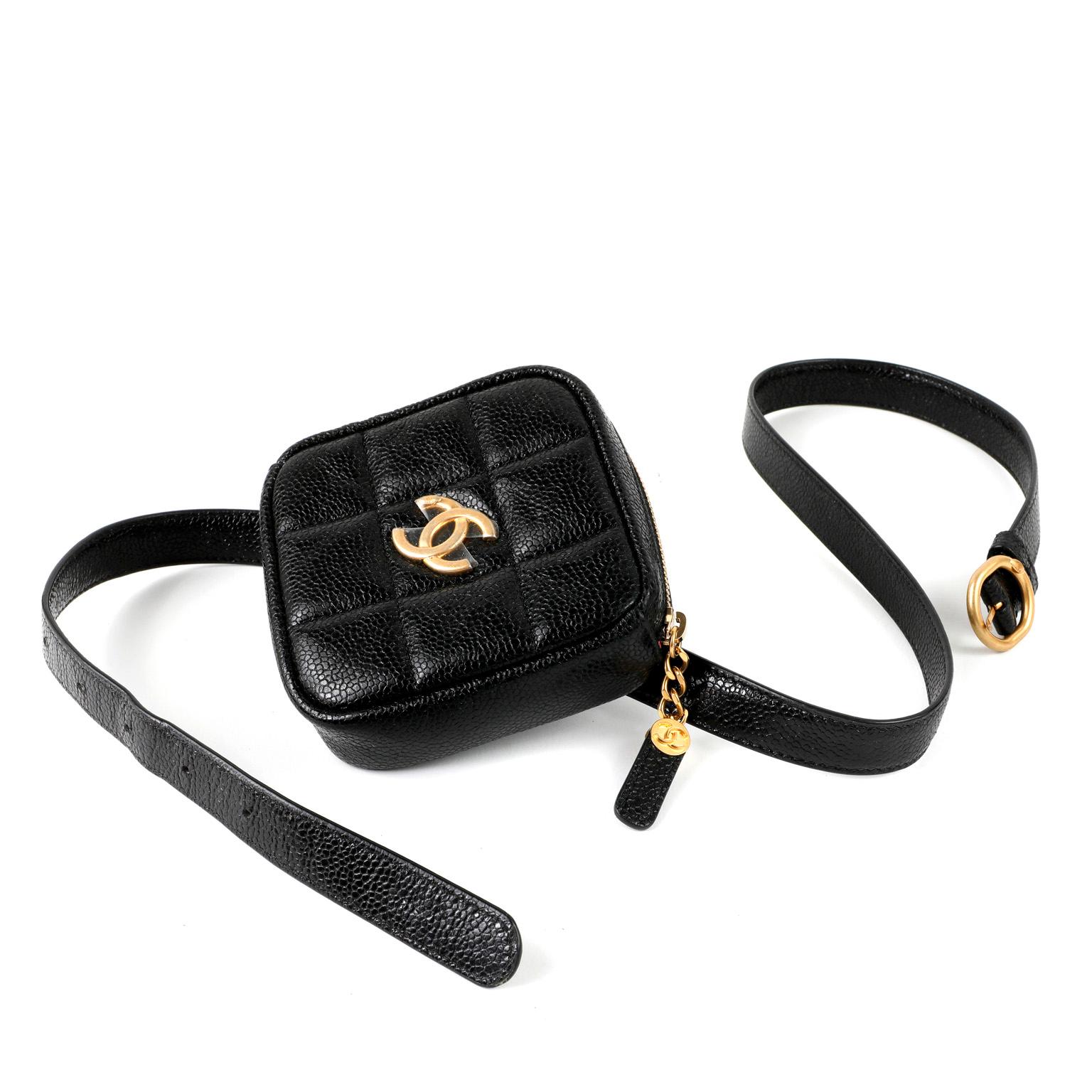 This authentic Chanel Black Caviar Leather Belt Bag is in pristine unworn condition.  Black square quilted zip top pouch in durable textured glazed caviar leather is anchored to a coordinating belt.  Gold tone hardware.  Adjustable length.  Dust bag