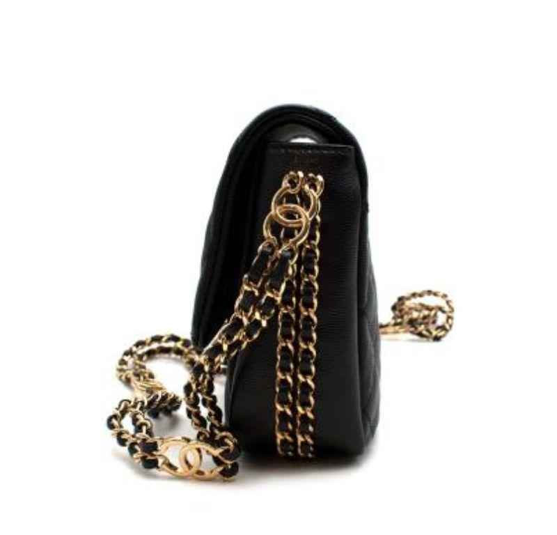 Chanel Black Caviar Leather Chain Around Flap Bag

-crafted in classic quilted caviar leather
- gold tone hardware
- chain draped sides
-single flap

dust bag included

Made in Italy

PLEASE NOTE, THESE ITEMS ARE PRE-OWNED AND MAY SHOW SIGNS OF