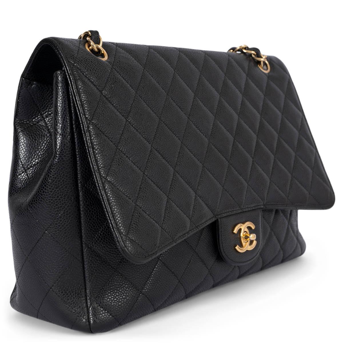 100% authentic Chanel Maxi Classic Timeless Single Flap Bag in black caviar leather featuring gold-tone hardware. Open pocket on the back. Closes with classic CC-turn-lock on the front. Lined in black lambskin with one zipper pocket and one open