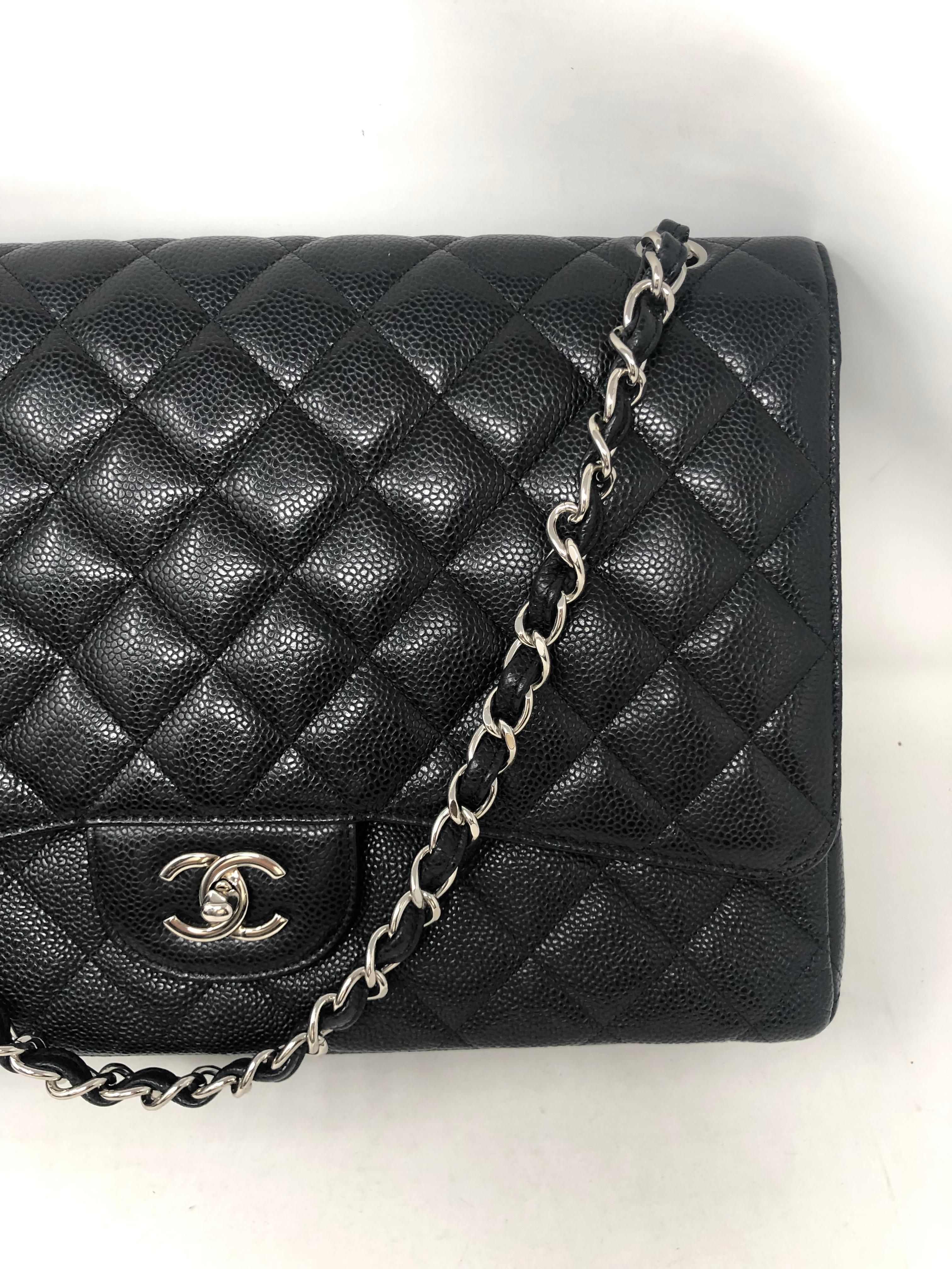 Chanel Black Caviar Leather Maxi Double Flap Bag. Silver hardware. Mint condition. Like new. 13