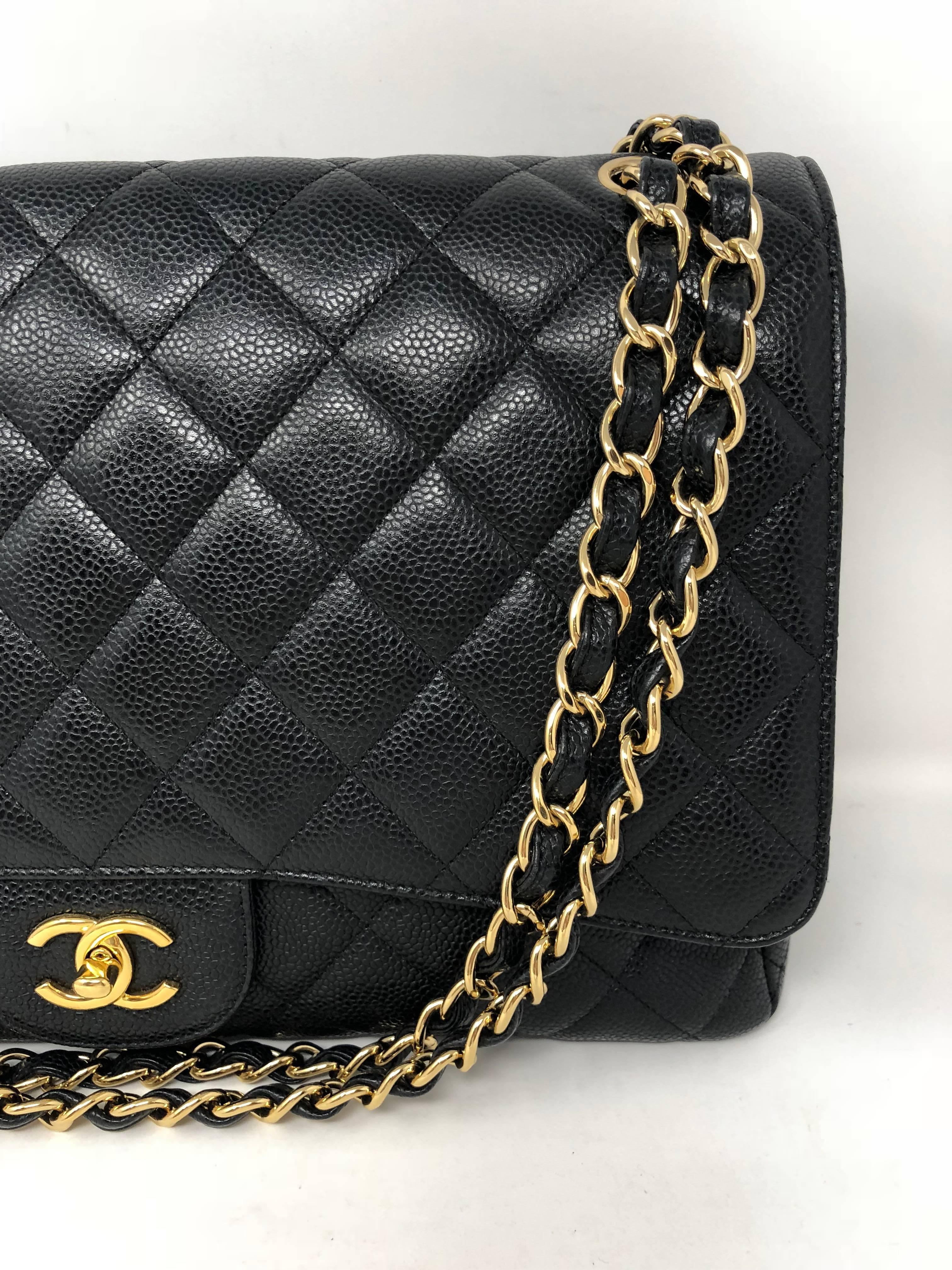 Chanel Black Caviar Leather Maxi Single Flap Bag with gold hardware. Mint condition wih slight wear. Bag can be worn doubled strap or as a crossbody. 