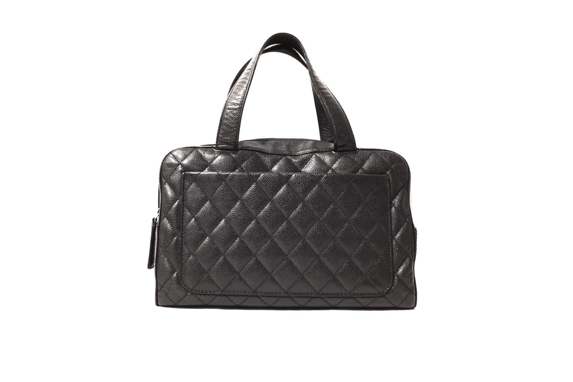 This authentic Chanel Black Caviar Quilted Satchel is in excellent condition. The perfect day bag, it carries everything yet manages effortless sophistication.
Textured and durable black caviar leather is quilted in signature Chanel diamond pattern.