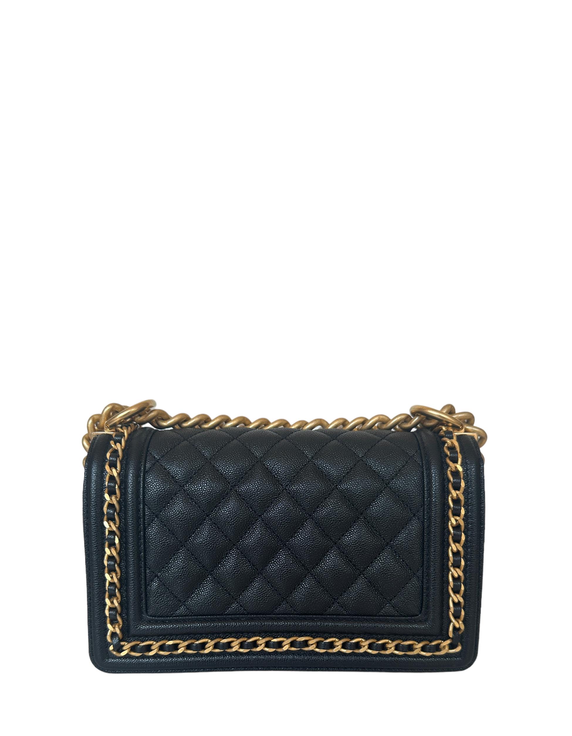 Chanel Black Caviar Leather Small Quilted Chain Around Boy Bag    
Made In: Italy
Color: Black and gold
Hardware: Goldtone
Materials: Caviar leather
Lining: Black leather
Closure/Opening: Flap top with pushlock
Exterior Pockets: None
Interior