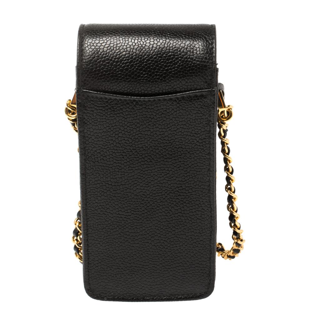 This phone holder from Chanel is stylish and practical. Crafted from caviar leather, it comes with an interior spacious enough to store your phone and other essentials like cards and cash. It features the CC logo on the front and is complete with an