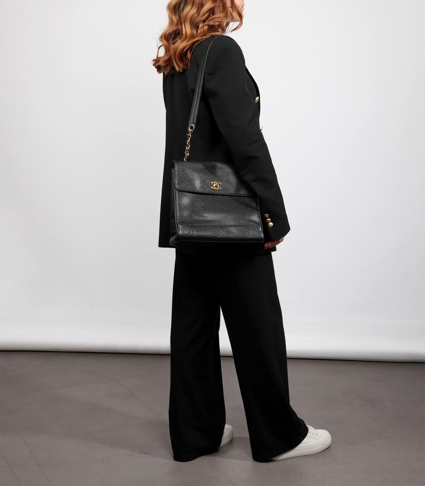 Chanel Black Caviar Leather Vintage Logo Trim Jumbo Classic Shoulder Bag

Product Details
Xupes Ref: HB5784
Brand: Chanel
Model: Jumbo Classic Shoulder Bag
Type: Shoulder
Serial Number: 4488114
Age: 1997
Accompanied By: Authenticity Card, Care