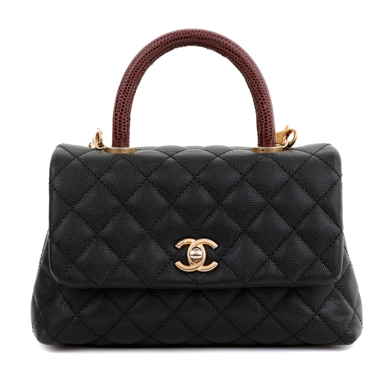 This authentic Chanel Black Caviar Lizard Coco Handle Small Flap Bag is in pristine condition.  Elegant and sophisticated with a hint of exotic, the Coco handle is an exquisite departure from the Classic Flap silhouette. 

Black caviar leather is