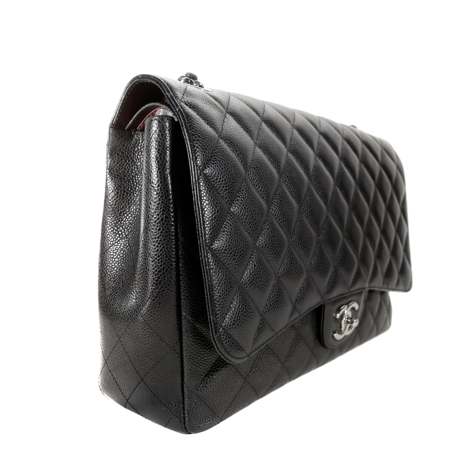 Chanel Black Caviar Maxi Classic- pristine condition
Chanel’s timeless classic flap in the maxi size with silver hardware is a must have in any collection.  
Durable black caviar leather is quilted in signature Chanel diamond pattern.  Silver