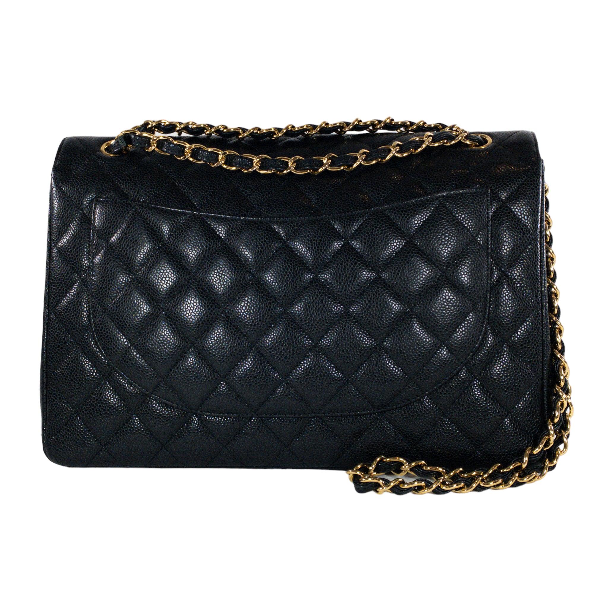 Chanel Black Caviar Maxi GHW Bag

This is an Authentic Chanel classic double flap in size Maxi. Black Caviar leather with gold hardware. Classic CC turn lock on front flap. Chain strap that can be worn singled or doubled, on the shoulder or