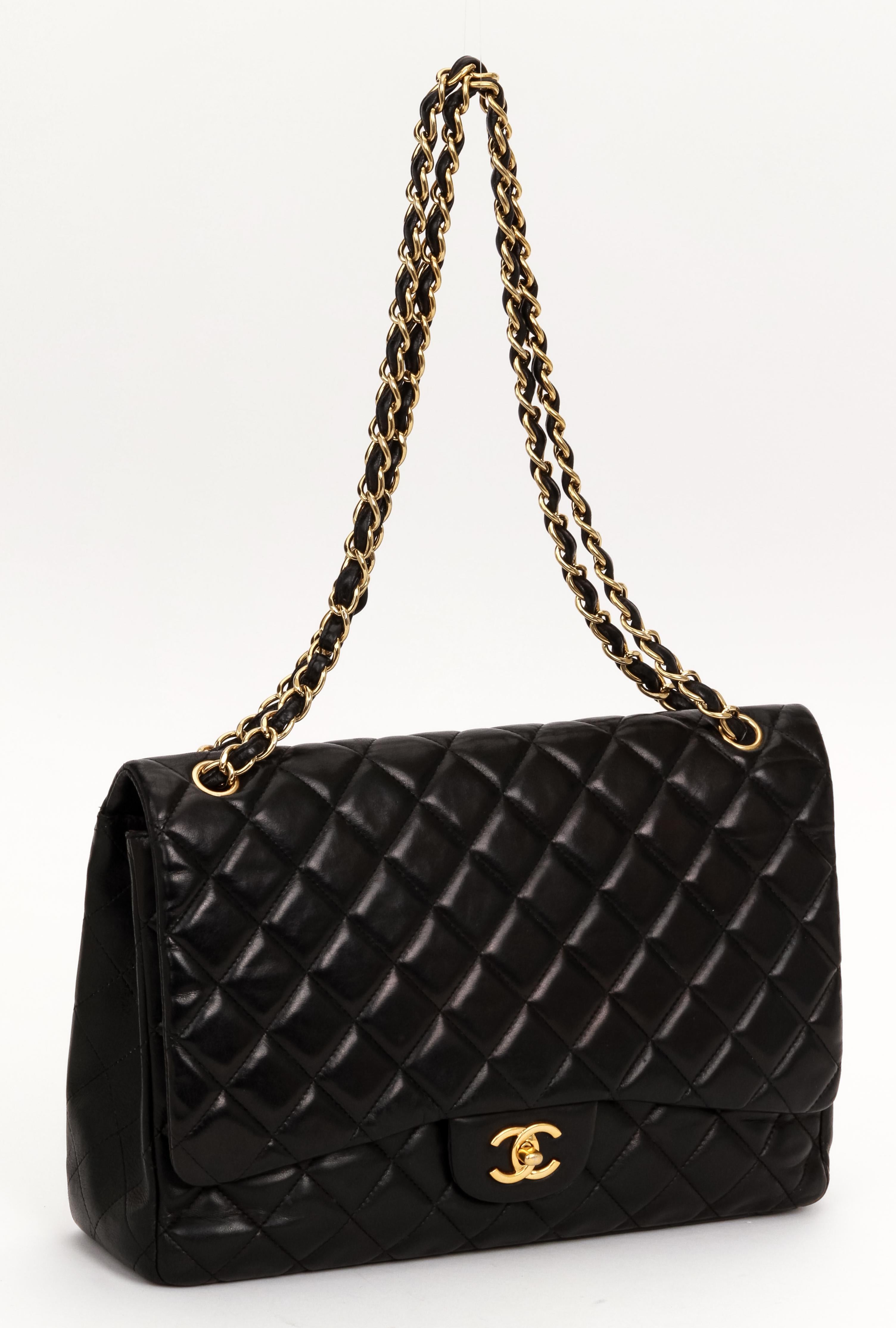 Chanel black quilted lambskin single maxi flap with gold tone hardware. Collection 2010. Shoulder drop 11