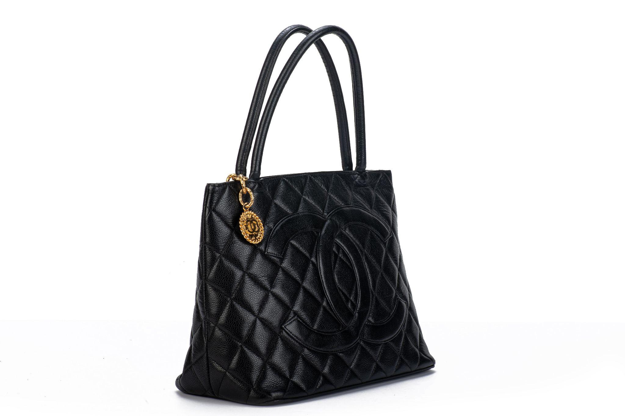 Chanel black quilted caviar medallion tote with gold tone hardware. Handle drop 6