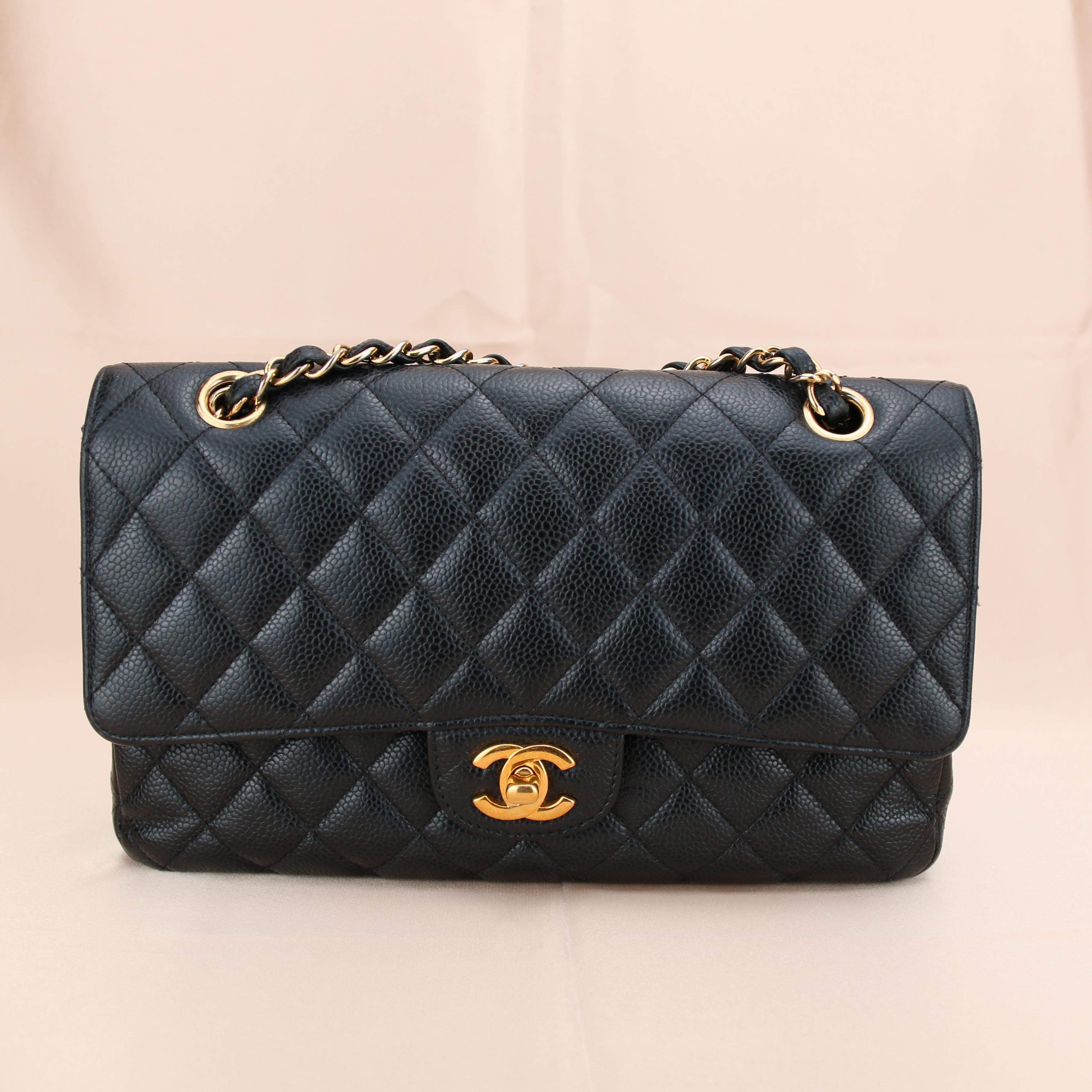 Dandelion Code	AT-1076
Brand	Chanel
Model	Timeless Classic Double Flap 
Serial No.	23******
Color	Black
Date	Approx. 2017
Metal	Gold
Material	Calfskin Caviar Leather
Measurements	Approx. 10in L x 2.8in W x 6in H
Condition	Excellent 
Comes