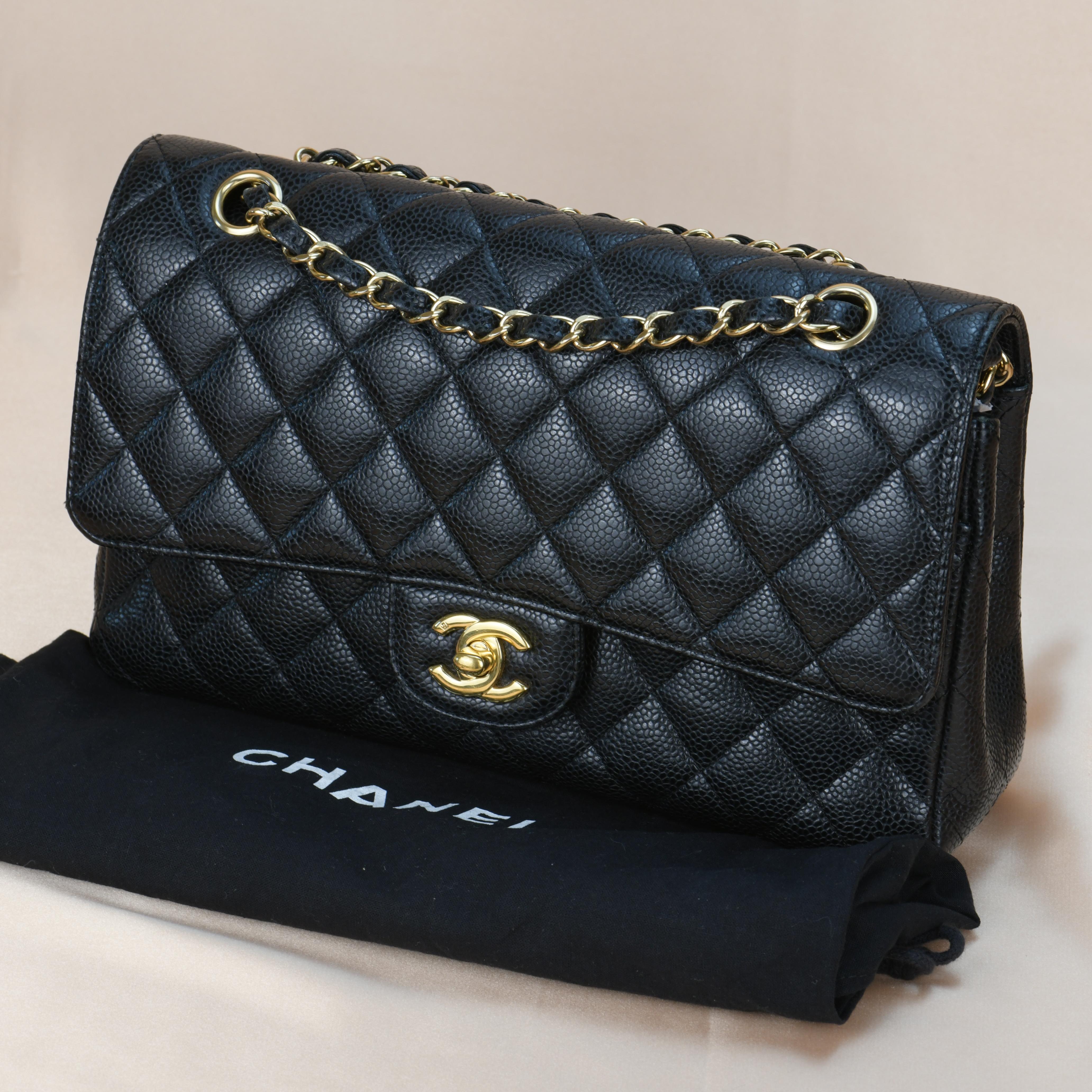 Dandelion Code	AT-1099
Brand	Chanel
Model	Timeless Classic Double Flap 
Serial No.	13******
Color	Black
Date	Approx. 2010
Metal	Gold
Material	Calfskin Caviar Leather
Measurements	Approx. 10in x 6in x 2.8in
Condition	Excellent 
Comes with	Chanel Dust