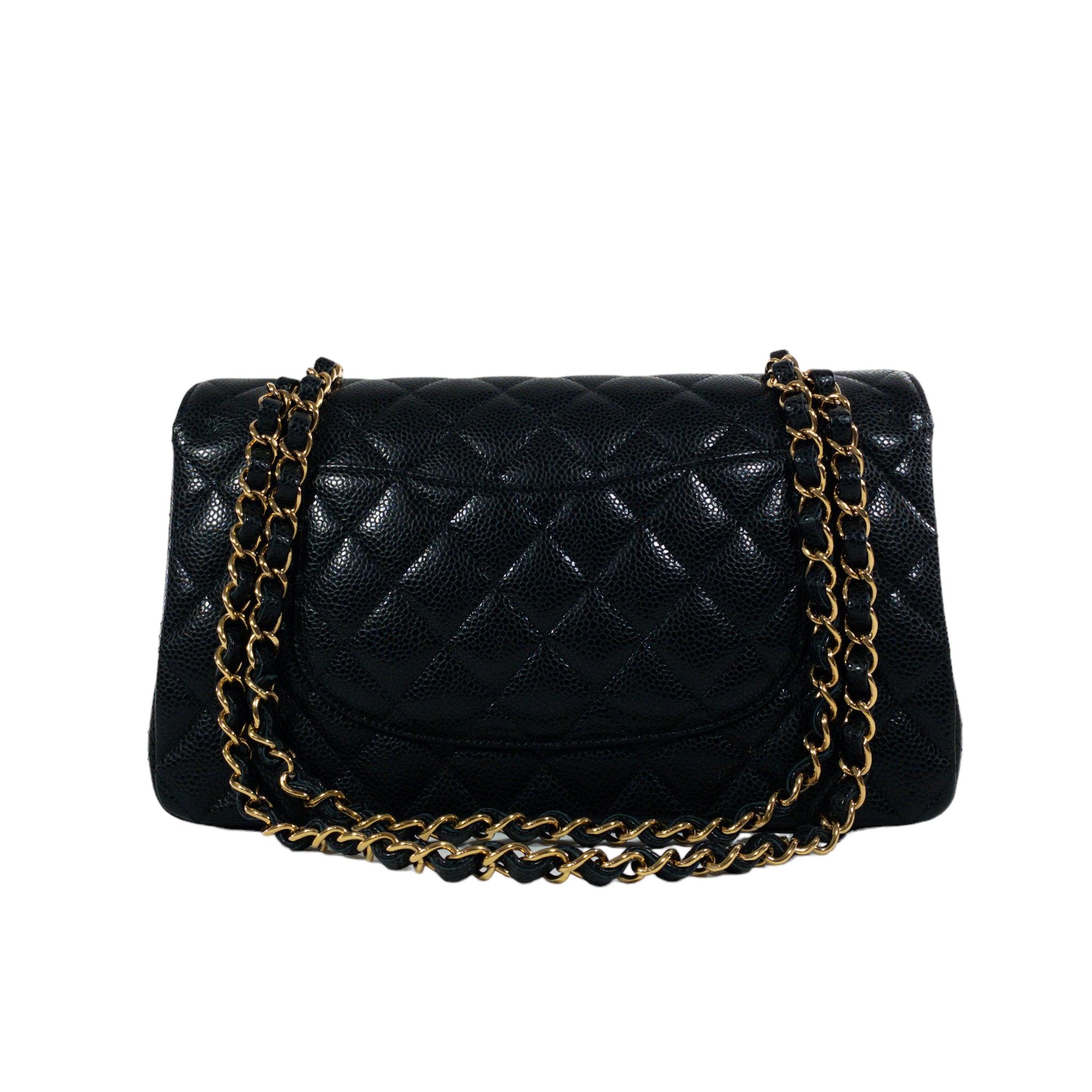 Consign of the Times presents this stunning Chanel Black Caviar Medium Classic Flap GHW.

This is an authentic Chanel Medium Classic Flap. The bag has a flap closure with a Double C logo turn lock. The interior is leather and includes one slip