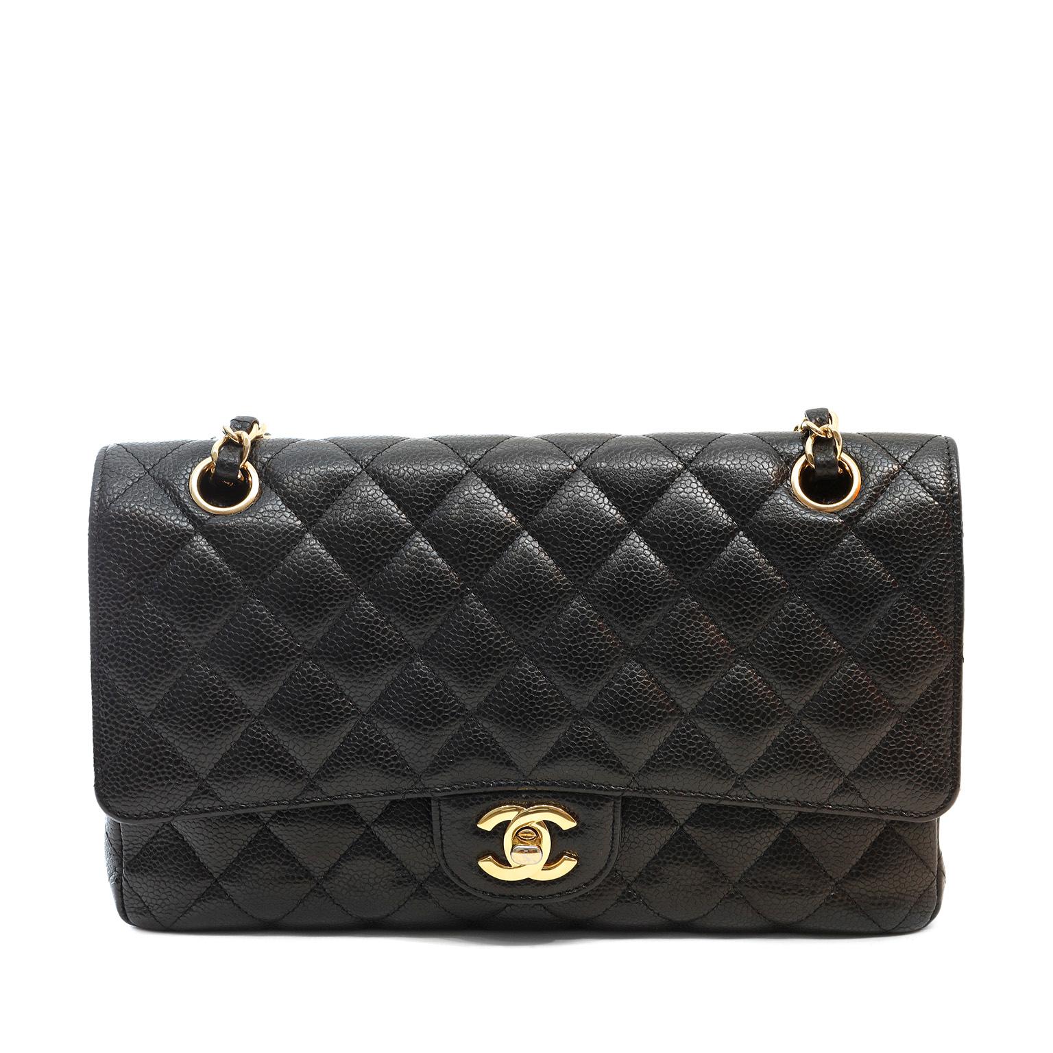 This authentic Chanel Black Caviar Leather Medium Classic Flap Bag is in pristine condition.  A key piece in any sophisticated wardrobe, the Classic Flap is one of the most sought-after Chanel styles produced.

Durable and textured black caviar