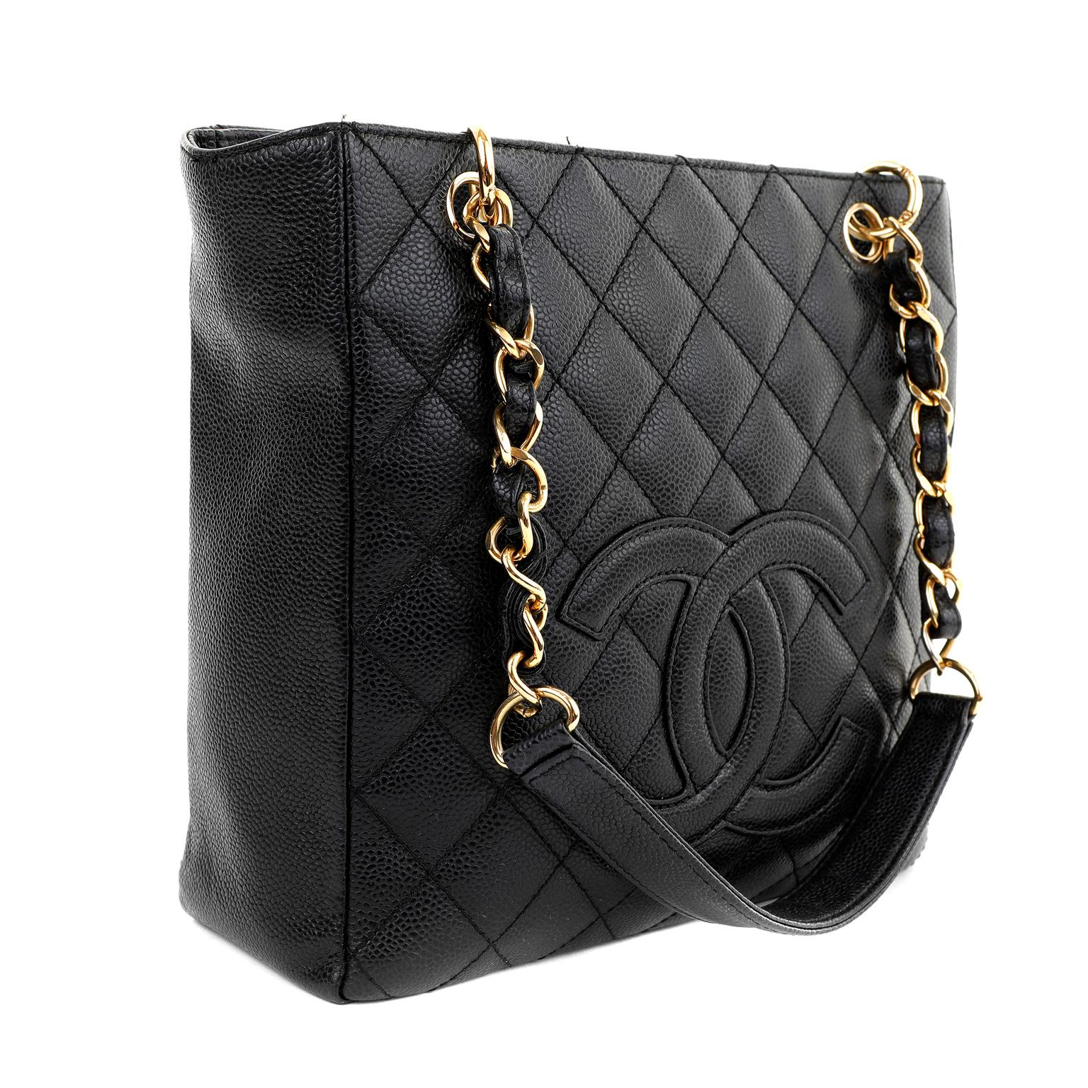 This authentic Chanel Black Caviar Petit Shopping Tote is in pristine condition.  The beloved PST is from the Timeless Classics Collection and is a versatile accompaniment to any ensemble. 
Textured and durable black caviar leather is quilted in