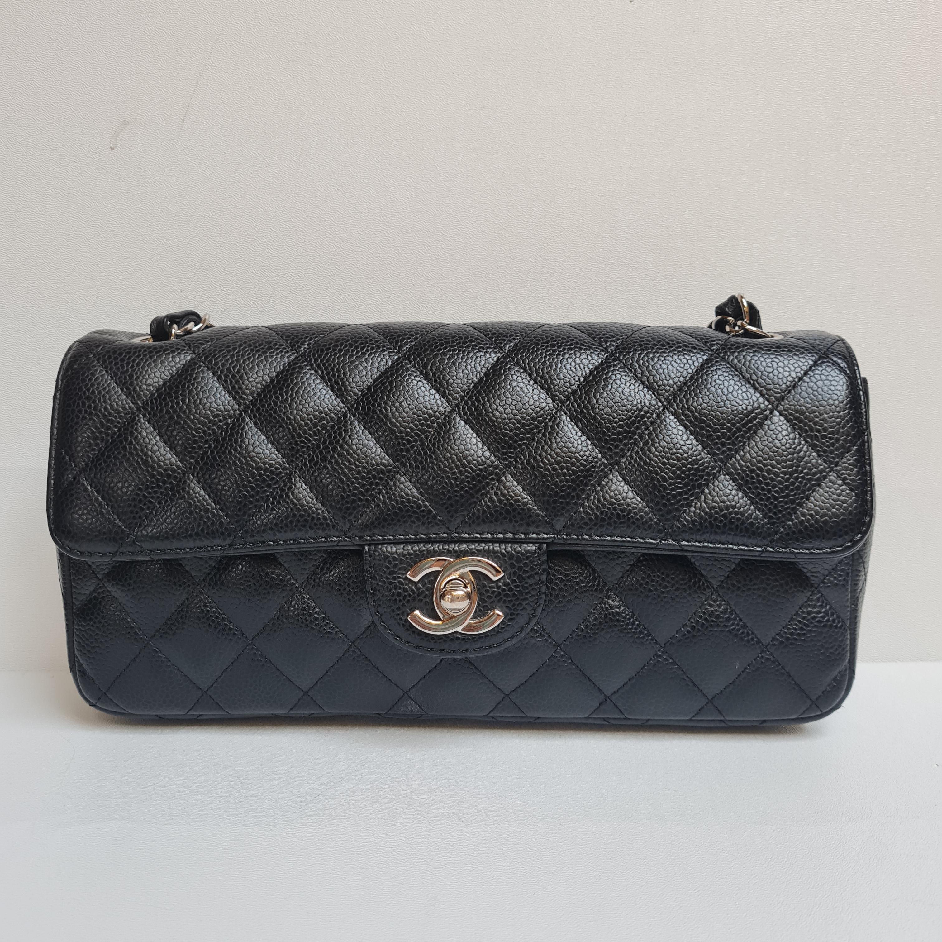 Chanel East west black caviar silver hardware. Item is still in great condition overall. Classic bag with a slightly different looks. Rare style in the market. Perfect as a shoulder bag.

Inclusion: Dust Bag, Box
Serial Number: #11
Closure: CC