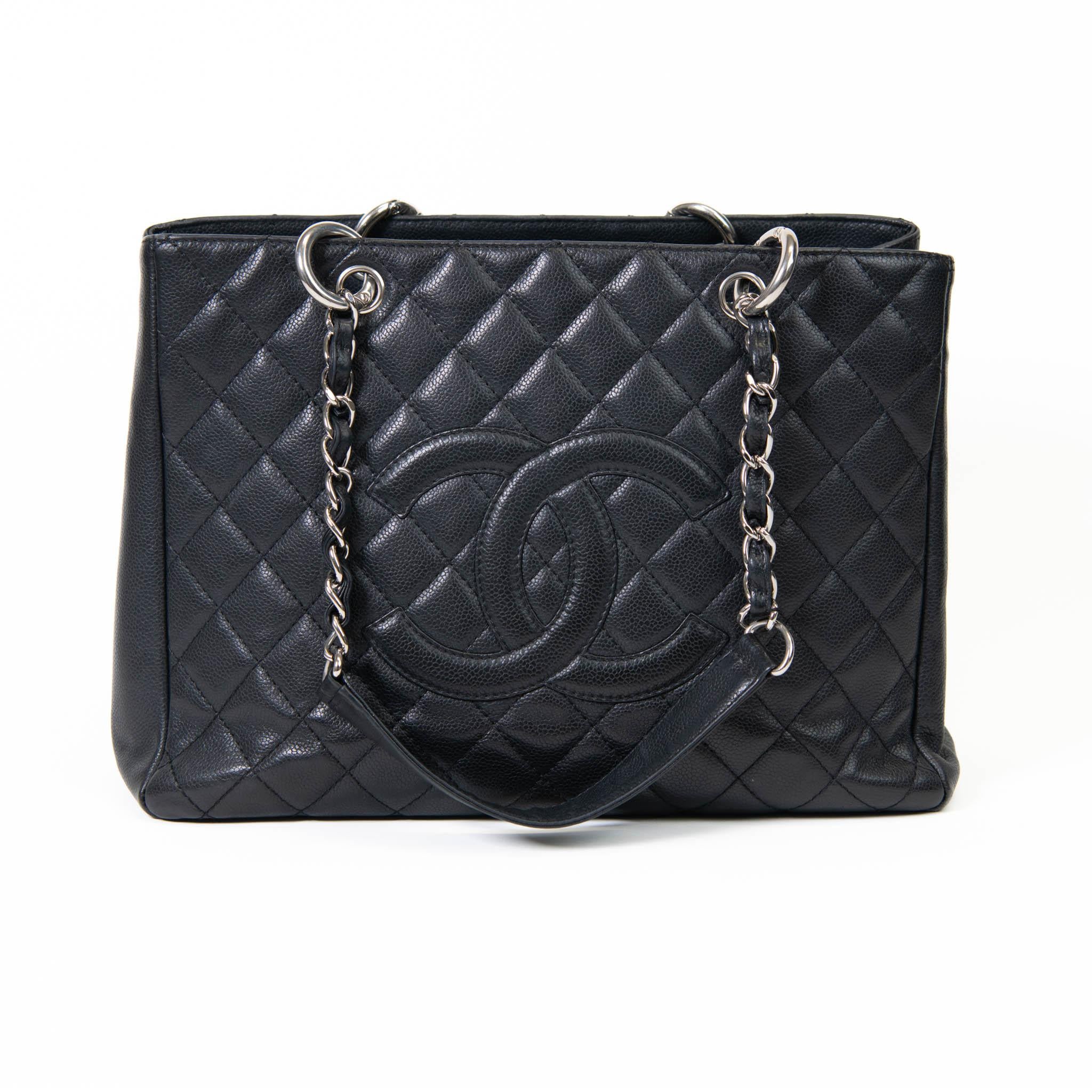 100% Authentic 
Chanel  Black Caviar Quilted Grand Shopping Tote GST Silver Hardware

 This stylish tote is crafted of black diamond quilted caviar leather. This shoulder bag features leather threaded polished gold chain-link shoulder straps with