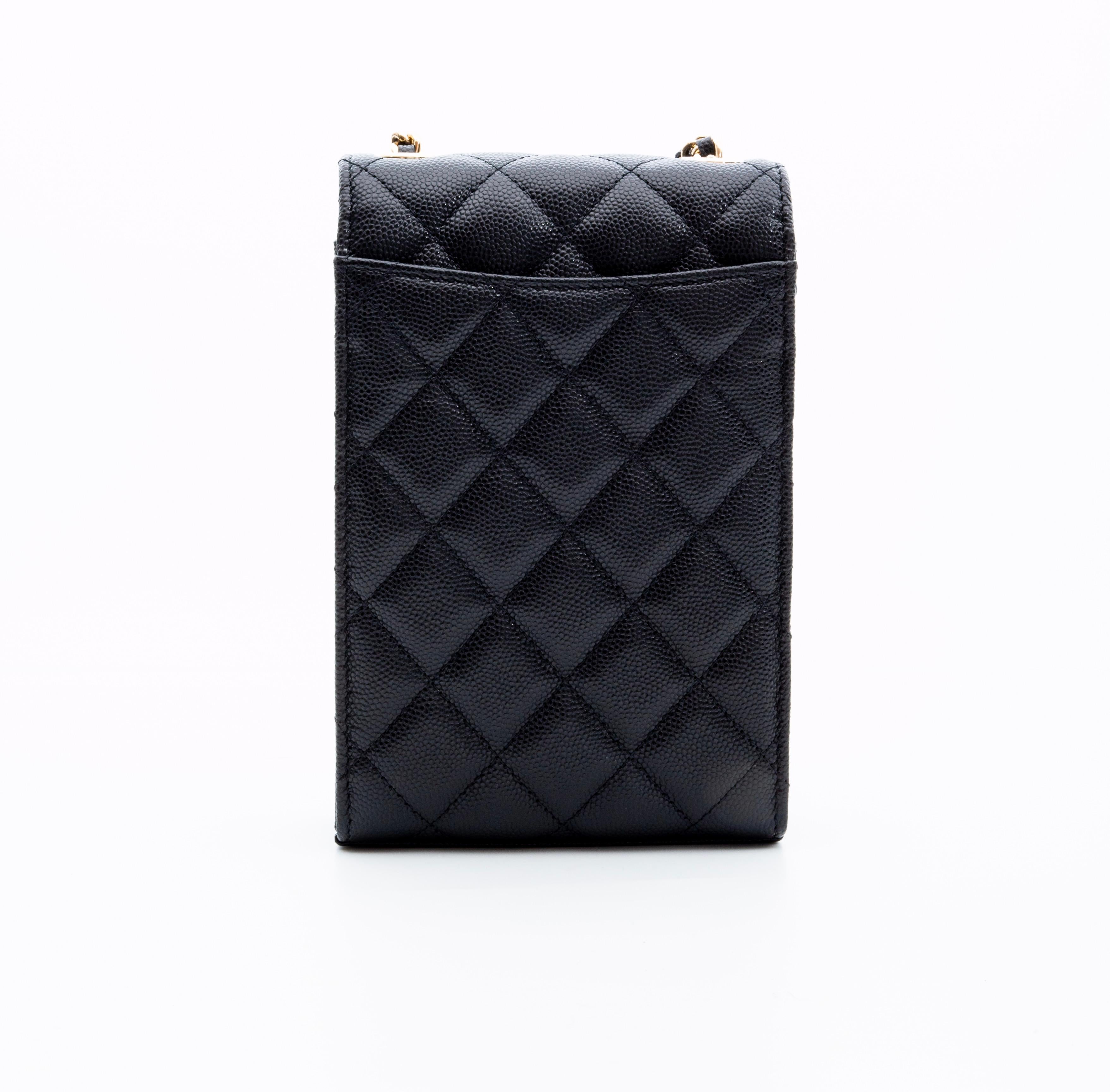 This bag is made of diamond quilted caviar leather (textured leather) in black and features polished gold hardware, a chain interlaced with leather shoulder strap, a back slip pocket, CC turn lock closure on front flap and an interior with leather