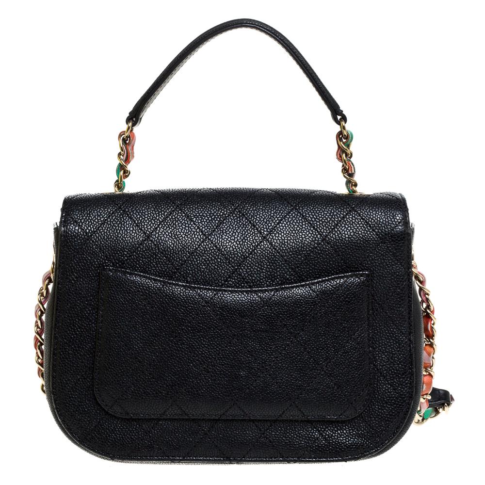 The Coco Curve flab bag from Chanel is truly timeless, extremely desirable and utterly high on style. The black beauty is crafted from caviar leather and enhanced with the signature quilted pattern. The bag flaunts a top handle and a shoulder strap