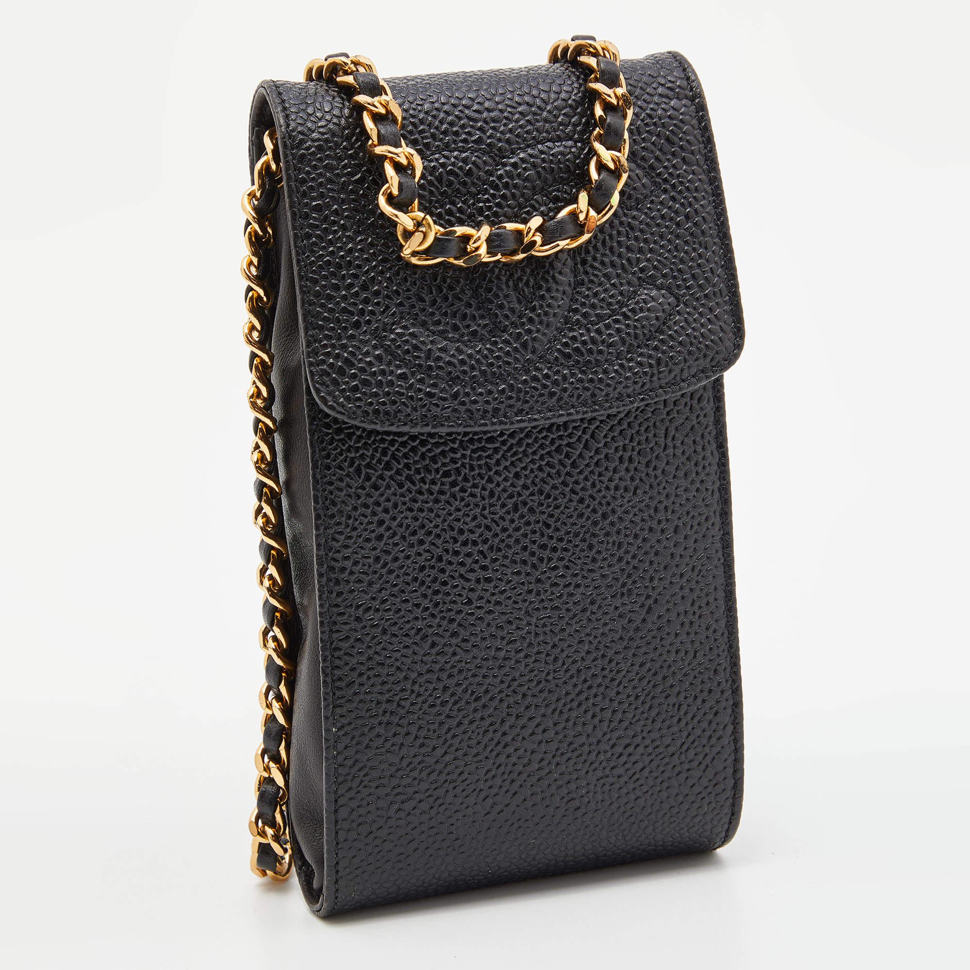 Carrying your phone will not be a hassle anymore, thanks to this super-cute phone case from Chanel. Its Caviar quilted leather exterior is complemented with a CC accent on the flap and the signature chain strap.

Includes: Original Dustbag
