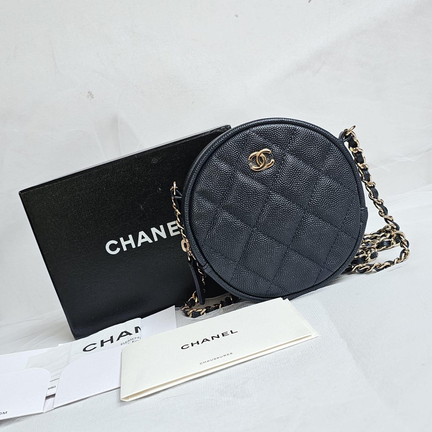 Beautiful mini round crossbody bag in black. Perfect for casual wear. Excellent condition overall. Comes with its holo and box.