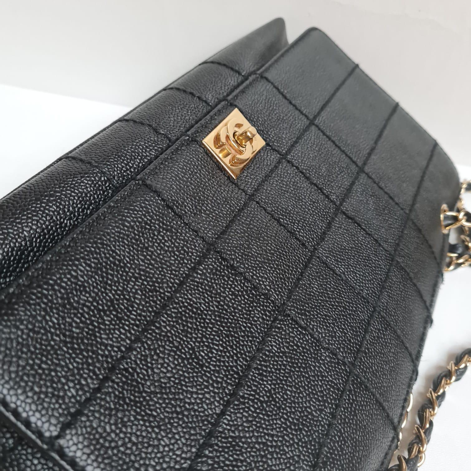 Chanel caviar quilted bag from early 2000s. Unique quilting details. In really great condition. Light wrinkling on the leather flap and the hologram has changed color due to storage. Comes as it is. Item series #7.
