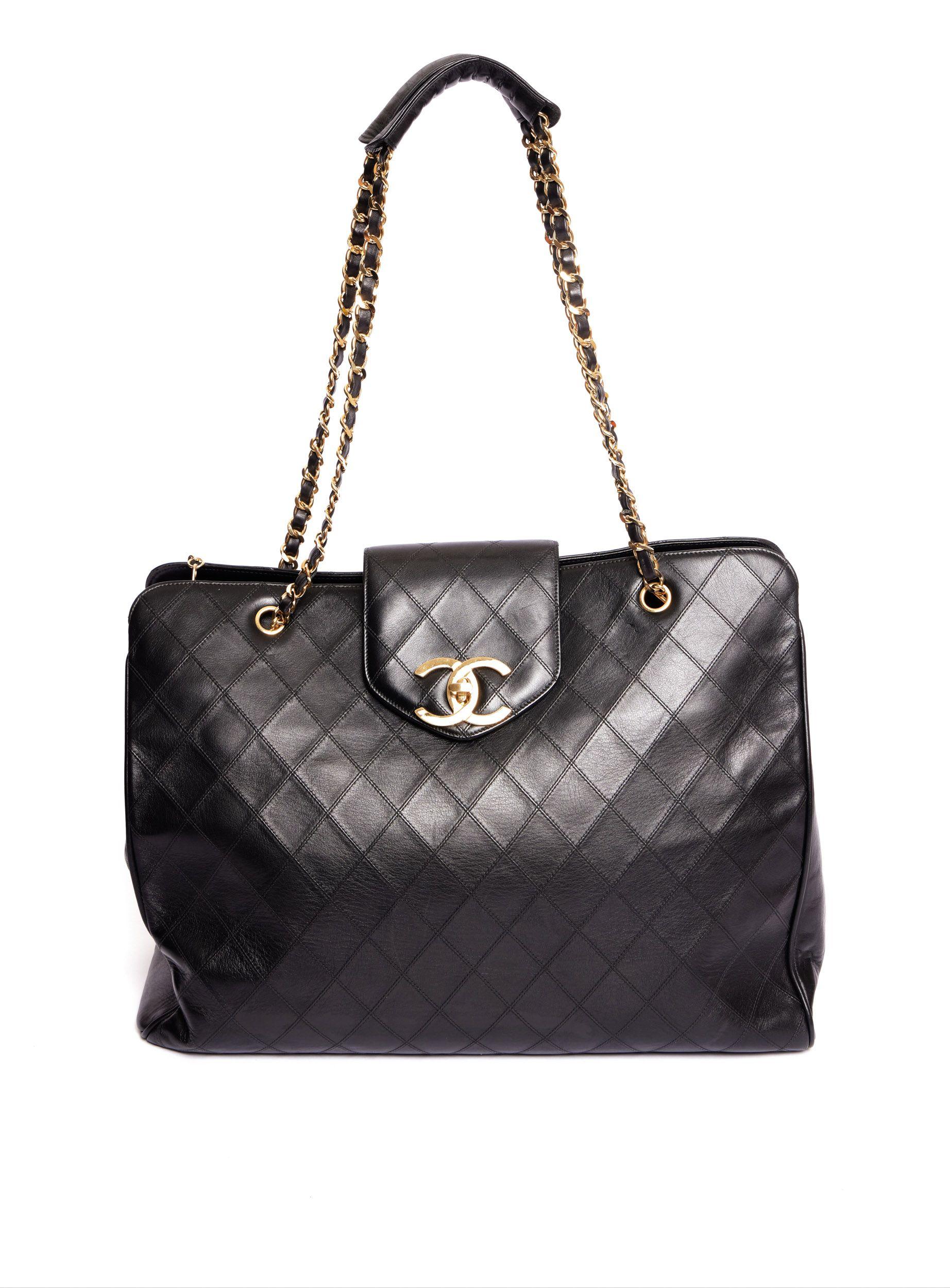 Chanel Supermodel flat quilted weekender. Black leather with gold tone hardware. Shoulder drop, 15