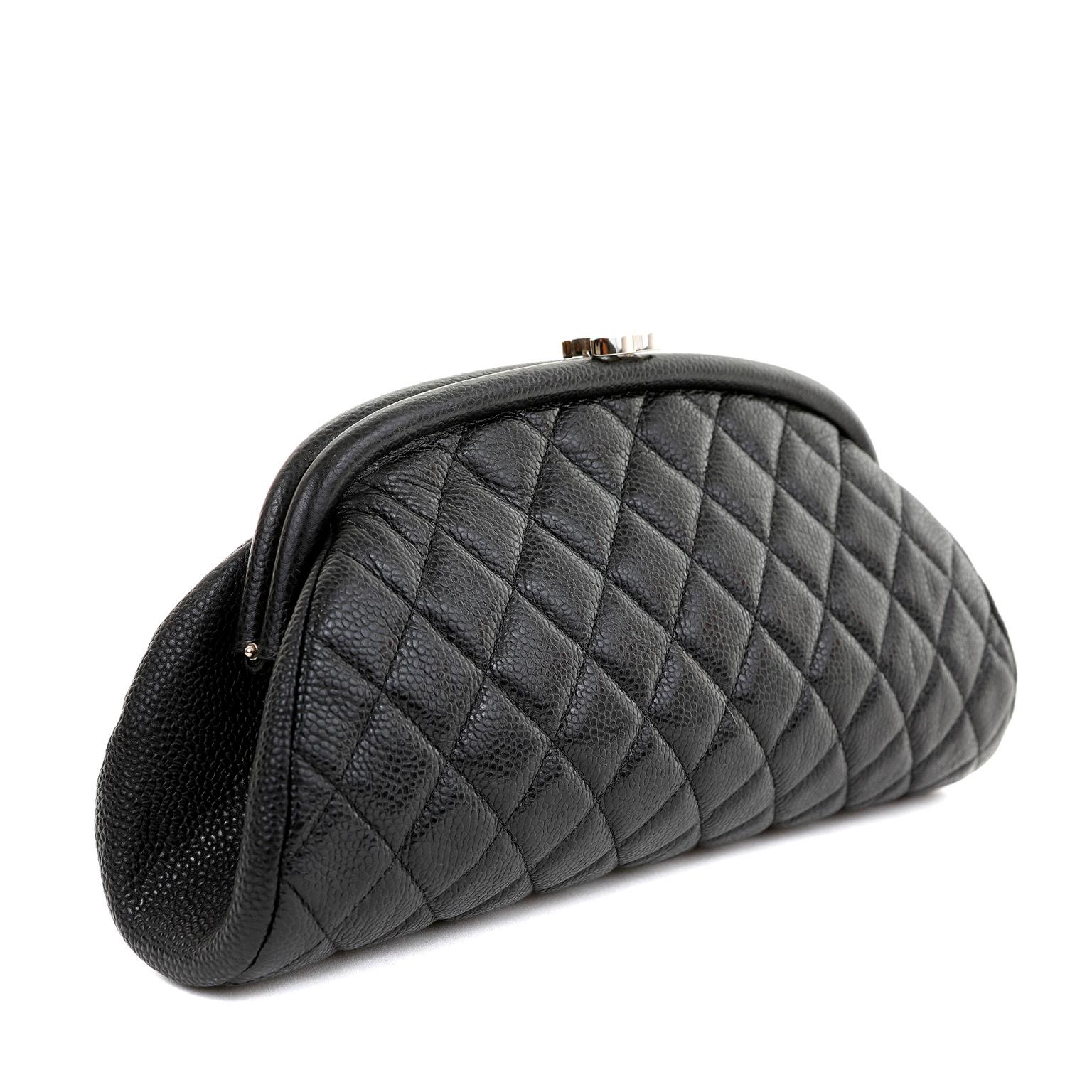 This authentic Chanel Black Caviar Timeless Clutch is in pristine condition. A true classic, this elegant black clutch is a key piece in any sophisticated wardrobe.
Black caviar leather is textured and durable.  Quilted in signature Chanel diamond