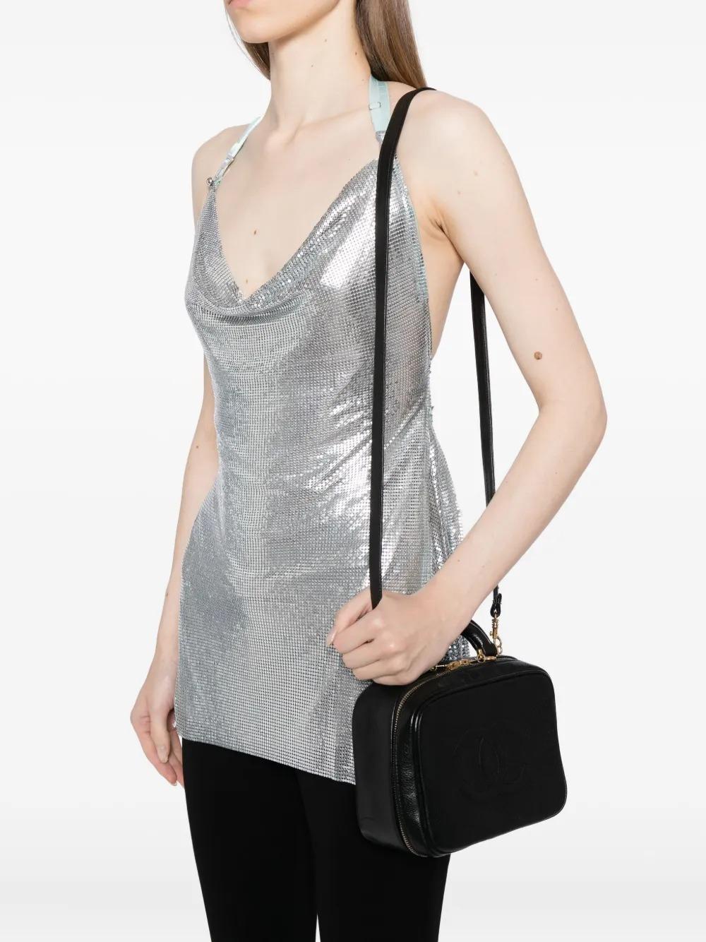 black vanity shoulder bag
top zip fastening
single top handle
detachable shoulder strap
embossed logo to the front
main compartment