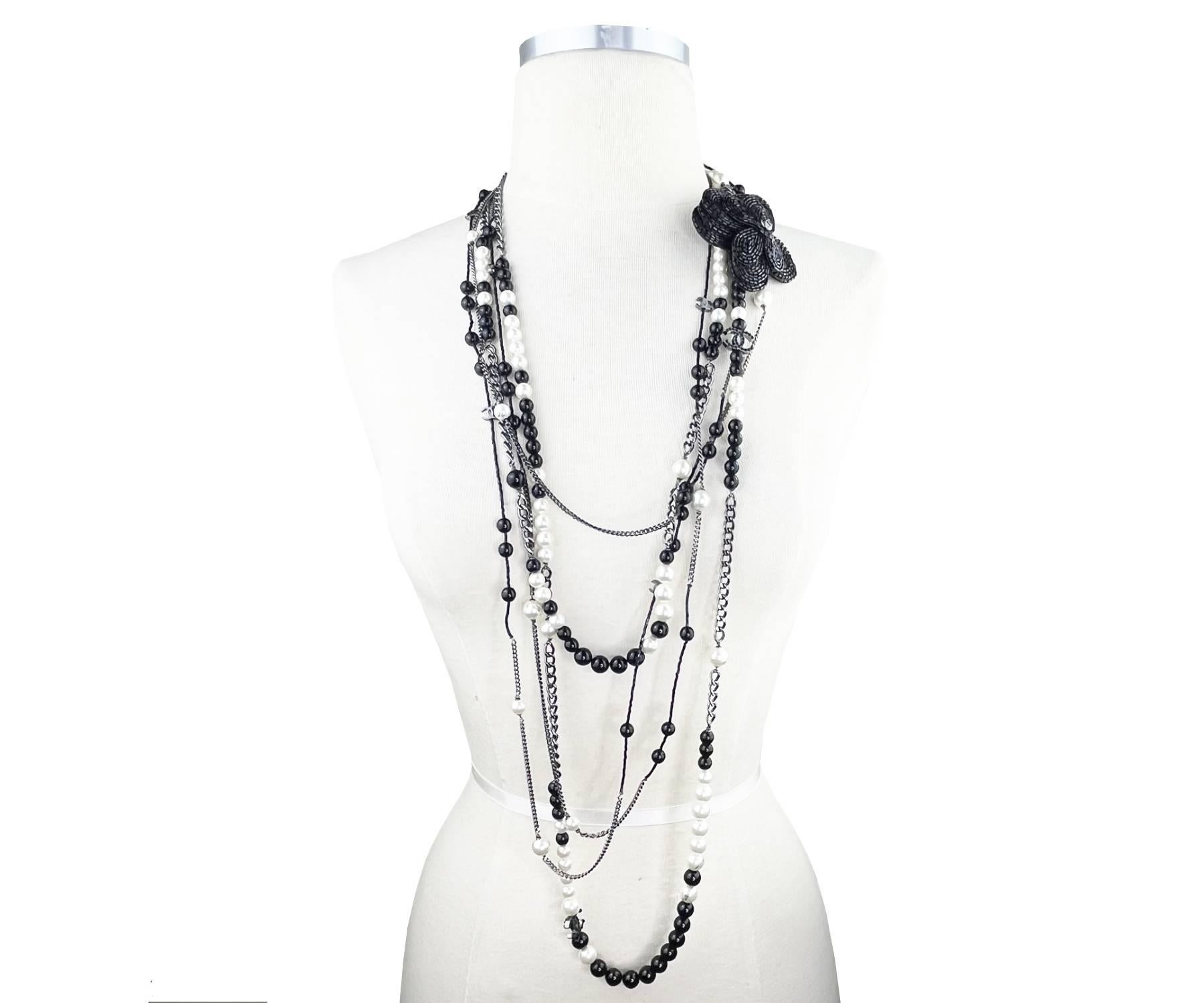 Chanel Black CC Beaded Flower Pin Black Bead Pearl 5 Strand Necklace

*Marked 03
*Made in France
*Comes with original box

-Approximately 46″ long
-The beaded flower brooch is approximately 3″ x 3″. It can’t be removed.
-Very classic and pretty
– In