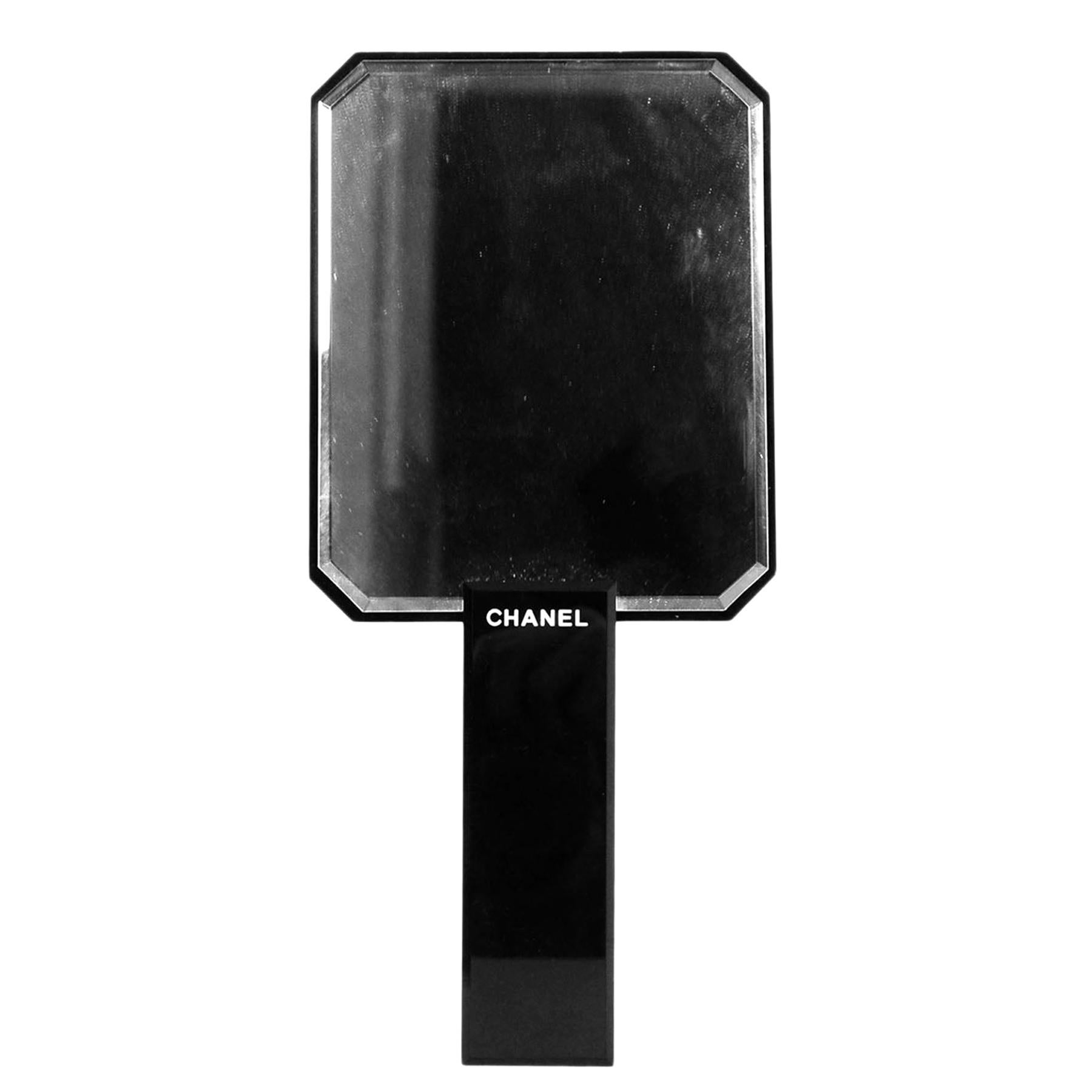 Chanel Black CC Hand Mirror

Color: Black
Materials: Acetate, glass
Overall Condition: Very good pre-owned condition, with a scratch to logo
Includes: Foam protector 

Measurements: 
4.5