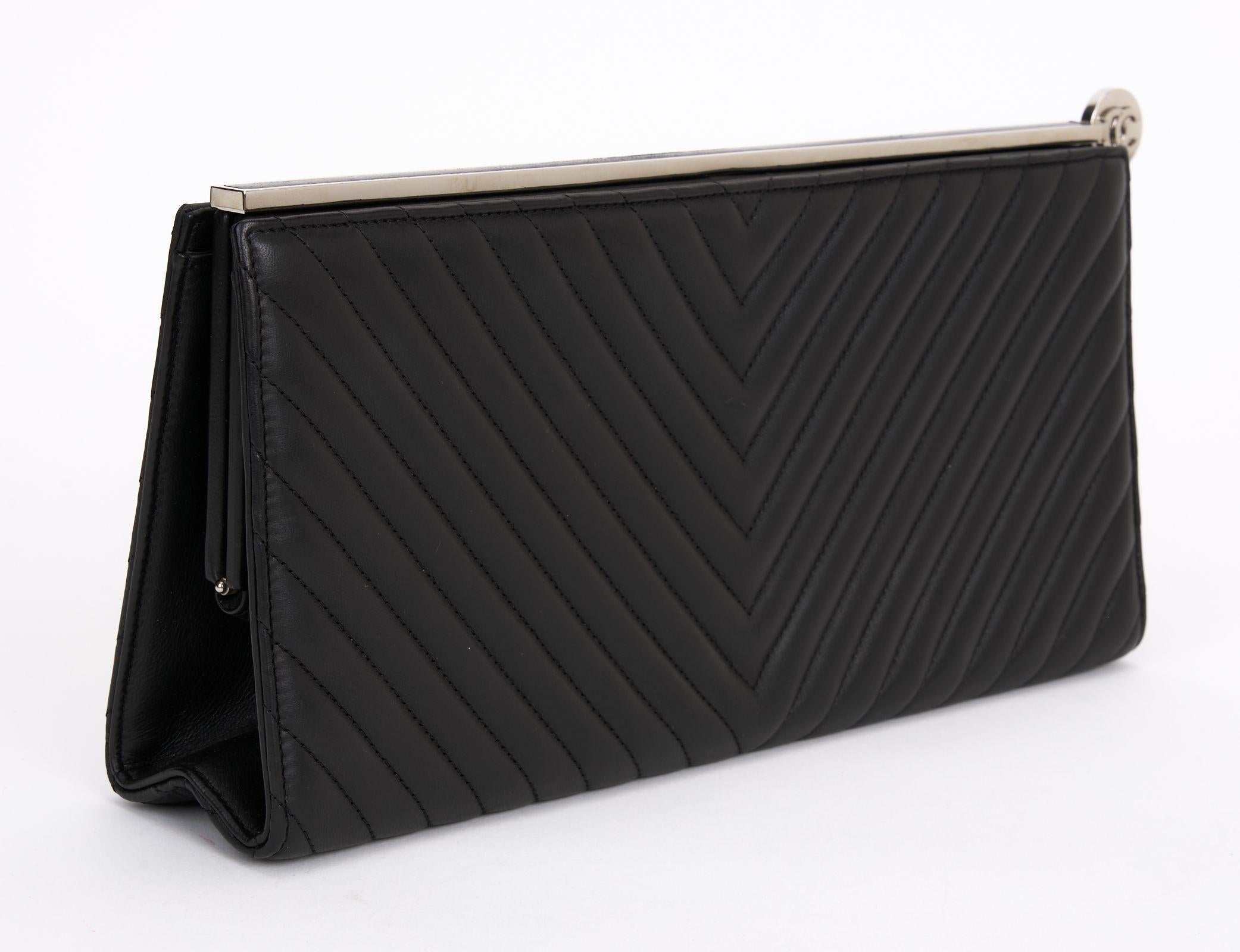 This Chanel clutch in black lambskin features a silk interior, invisible closure under a bar of steel and leather, and a silver metal CC logo is tilted to open the cover.
Make your next evening out tres chic with this classic clutch.
Comes with