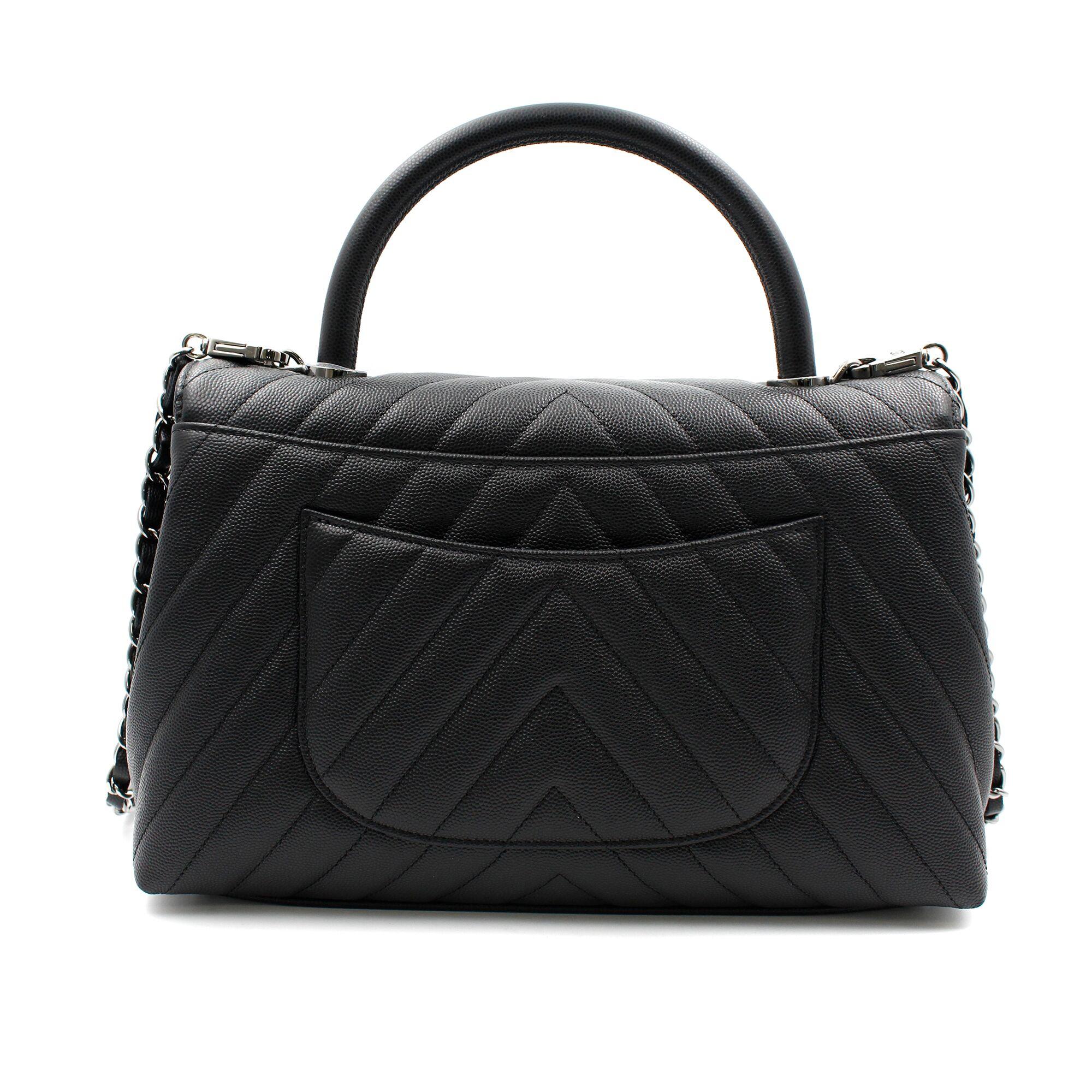 New Chanel Chevron Medium Flap Bag in black shiny calfskin with ruthenium-finish hardware. This bag features a top handle, a front flap with signature CC turn-lock closure with a half moon back pocket and an adjustable interwoven ruthenium-finish