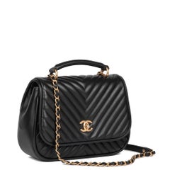 CHANEL Black Chevron Quilted Lambskin Medium Classic Top Handle Flap Bag