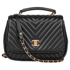 CHANEL Black Chevron Quilted Lambskin Medium Classic Top Handle Flap Bag