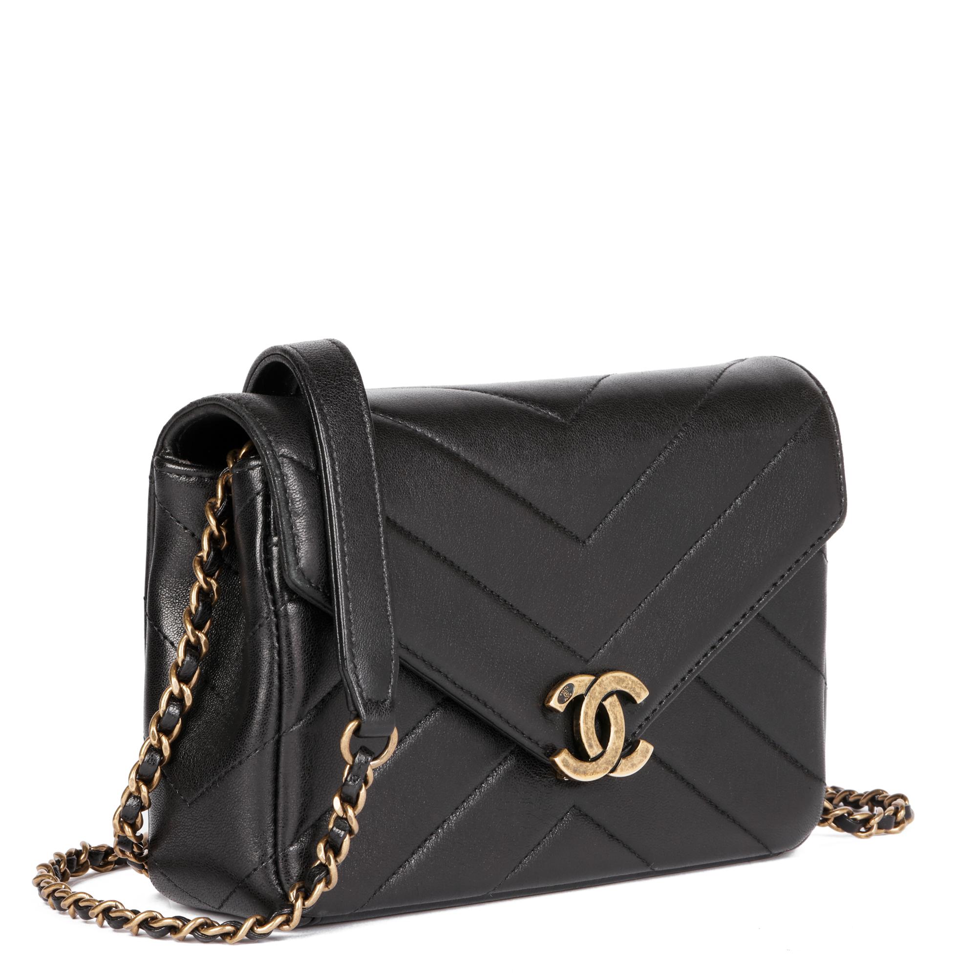 CHANEL 
Black Chevron Quilted Lambskin Mini Envelope Single Flap Bag

Xupes Reference: CB767
Serial Number: 22066471
Age (Circa): 2016
Accompanied By: Chanel Dust Bag, Protective Felt, Authenticity Card
Authenticity Details: Authenticity Card,
