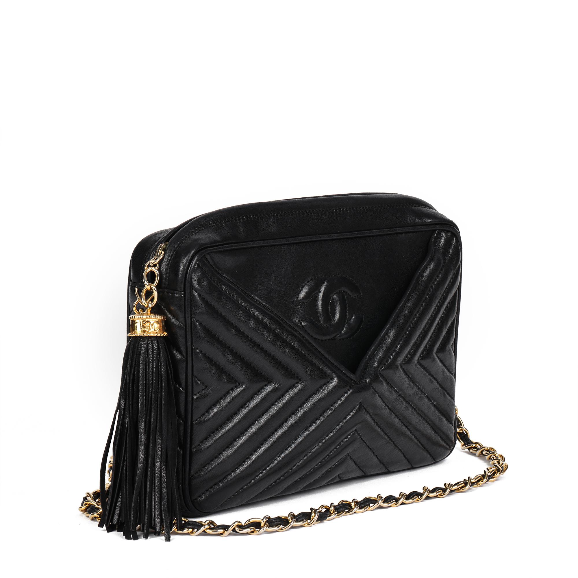 CHANEL
Black Chevron Quilted Lambskin Vintage Fringe Timeless Camera Bag

Xupes Reference: CB735
Serial Number: 749420
Age (Circa): 1988
Accompanied By: Chanel Dust Bag
Authenticity Details: Serial Sticker (Made in Italy)
Gender: Ladies
Type: