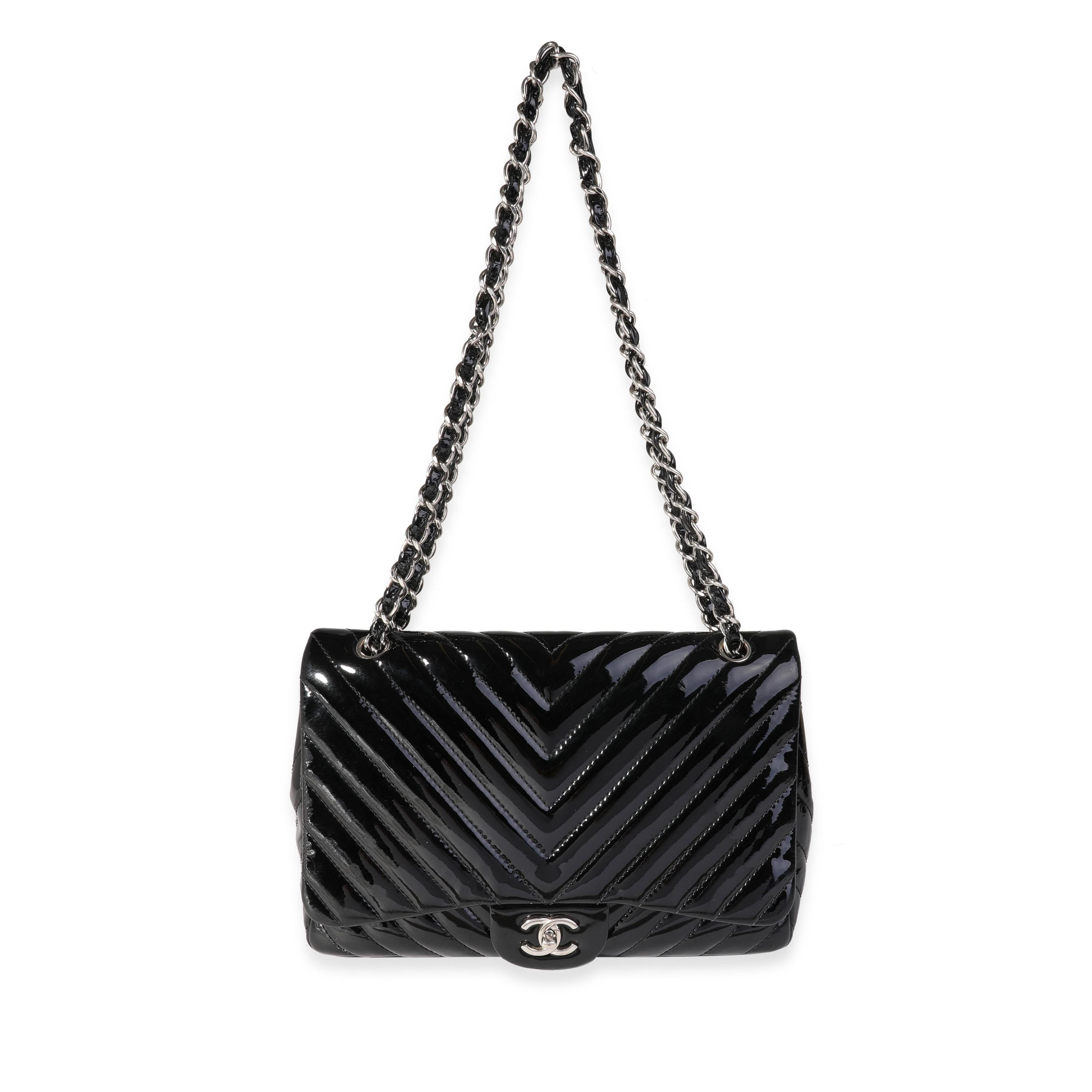 Listing Title: Chanel Black Chevron Quilted Patent Leather Jumbo Classic Single Flap Bag
SKU: 121674
MSRP: 9500.00
Condition: Pre-owned 
Handbag Condition: Very Good
Condition Comments: Very Good Condition. Wear to patent leather at corners. Marks