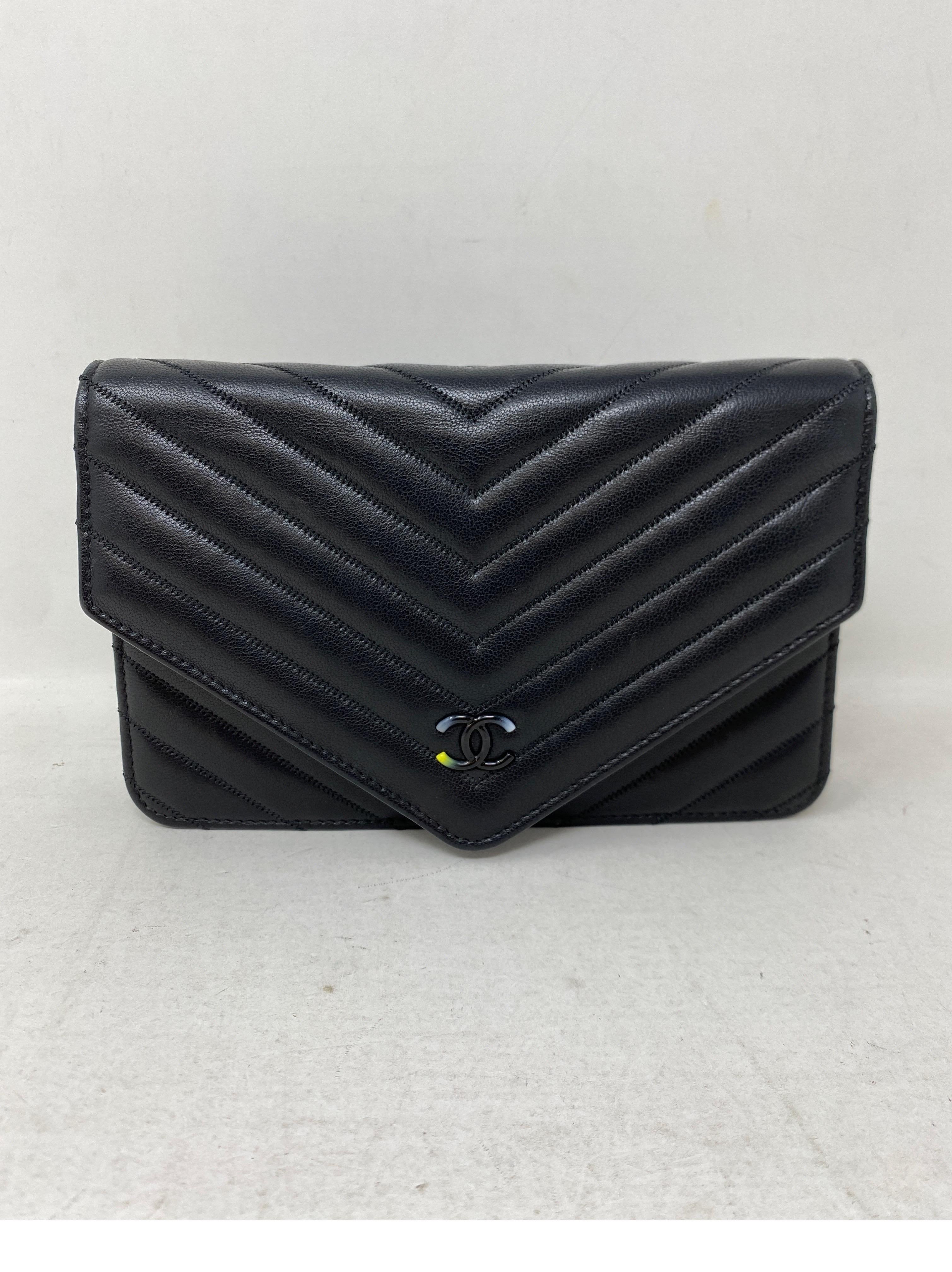 Chanel Chevron Black Wallet On A Chain Bag. Rare CC multi-color plastic lucite material. Black chevron leather. MInt like new condition. Can be worn as a crossbody or doubled as a shoulder bag. Also can be worn as a clutch. Includes authenticity