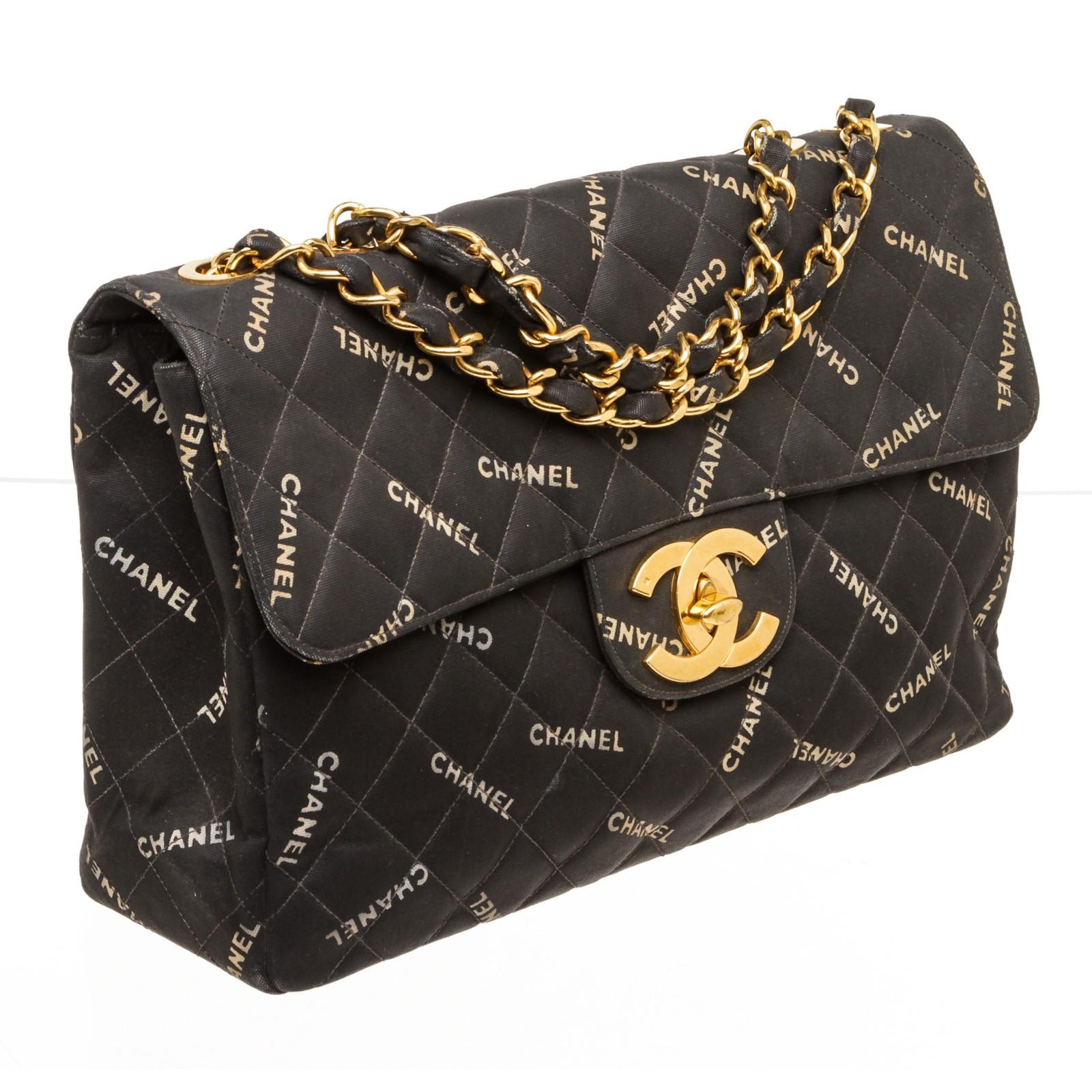 Crafted out of black coated canvas, CHANEL logo throughout canvas, CC turn lock at front, and gold-tone hardware. 18101MSC.