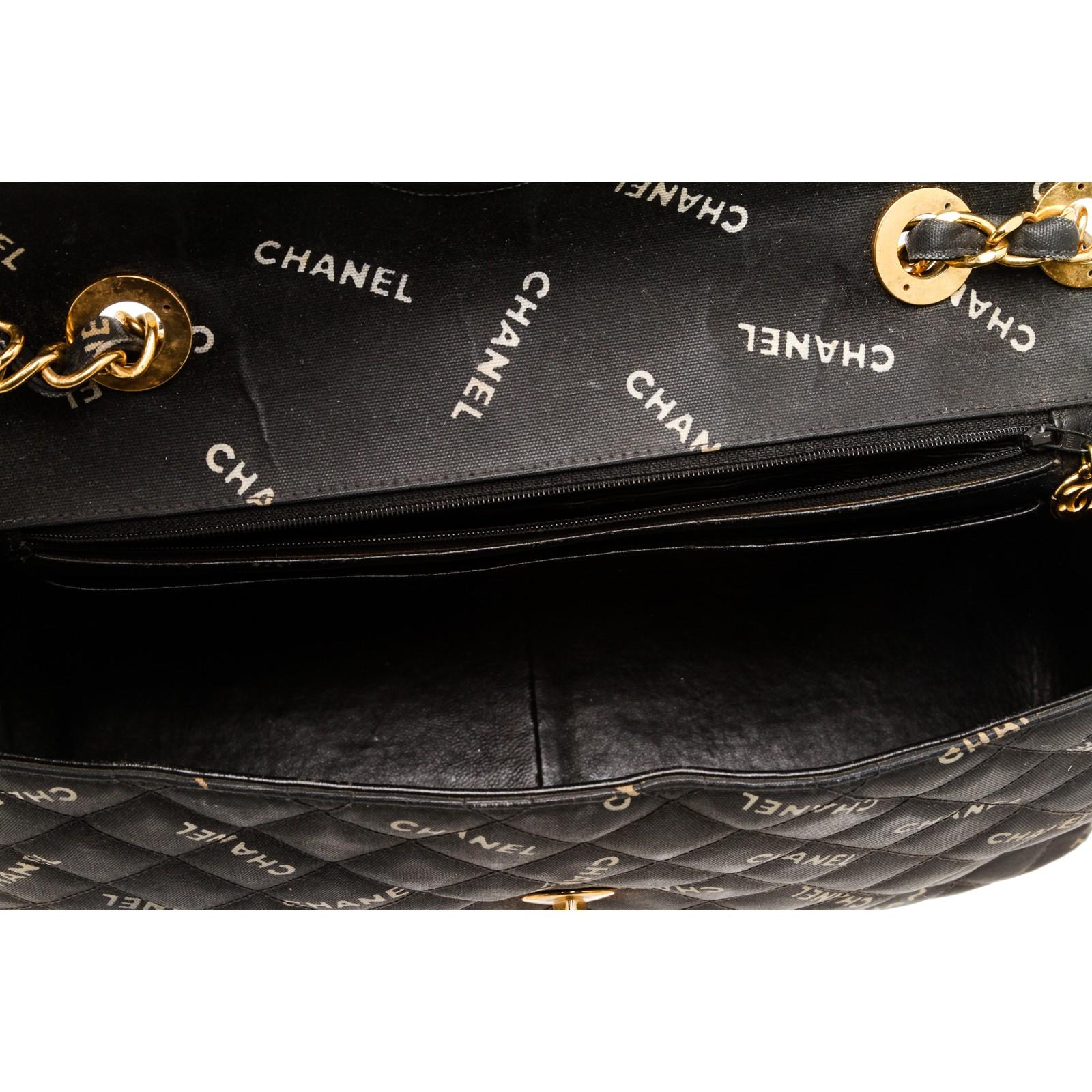 Women's or Men's Chanel Black Coated Canvas Logo Half Flap Maxi Vintage Bag
