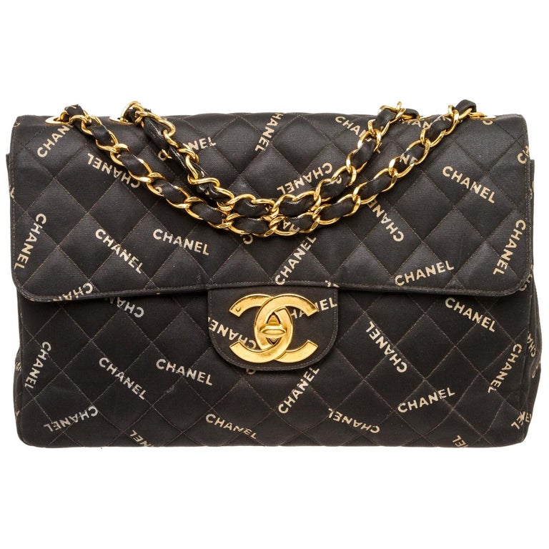 Chanel Black Coated Logo Flap Maxi Vintage Bag at 1stDibs