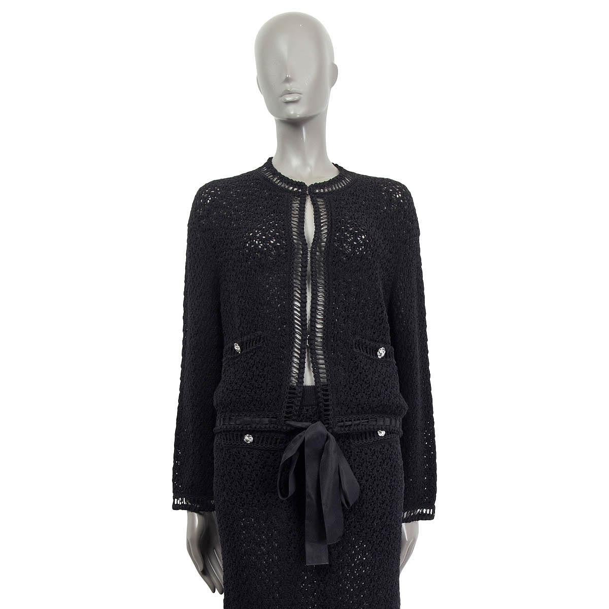 100% authentic  Chanel longsleeve cardigan in black cotton (65%) and polyamide (35%). Pre Spring/summer 2020 collection. Embellished with two faux slit pockets and silver metallic flower buttons. Has an elastic band and opens with hooks and a black