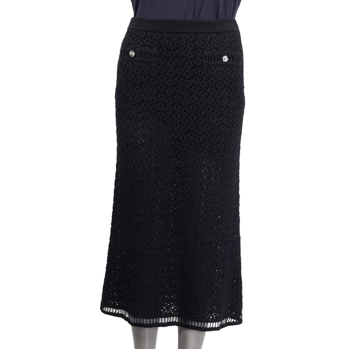 100% authentic  Chanel high rise crochet midi skirt in black cotton (65%) and polyamide (35%). Pre spring/summer 2020 collection. Embellished with two faux slit pockets and silver metallic flower buttons. Has an elastic waistband and opens with a