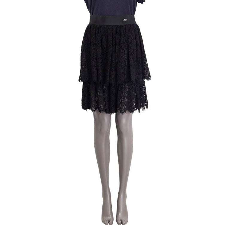 100% authentic Chanel Spring 2013 lace skorts in black cotton (60%), rayon (30%) and nylon (10%). Features a satin waistband and a silver metal 'CC' emblem at the front. Unlined. Has been worn and is in excellent