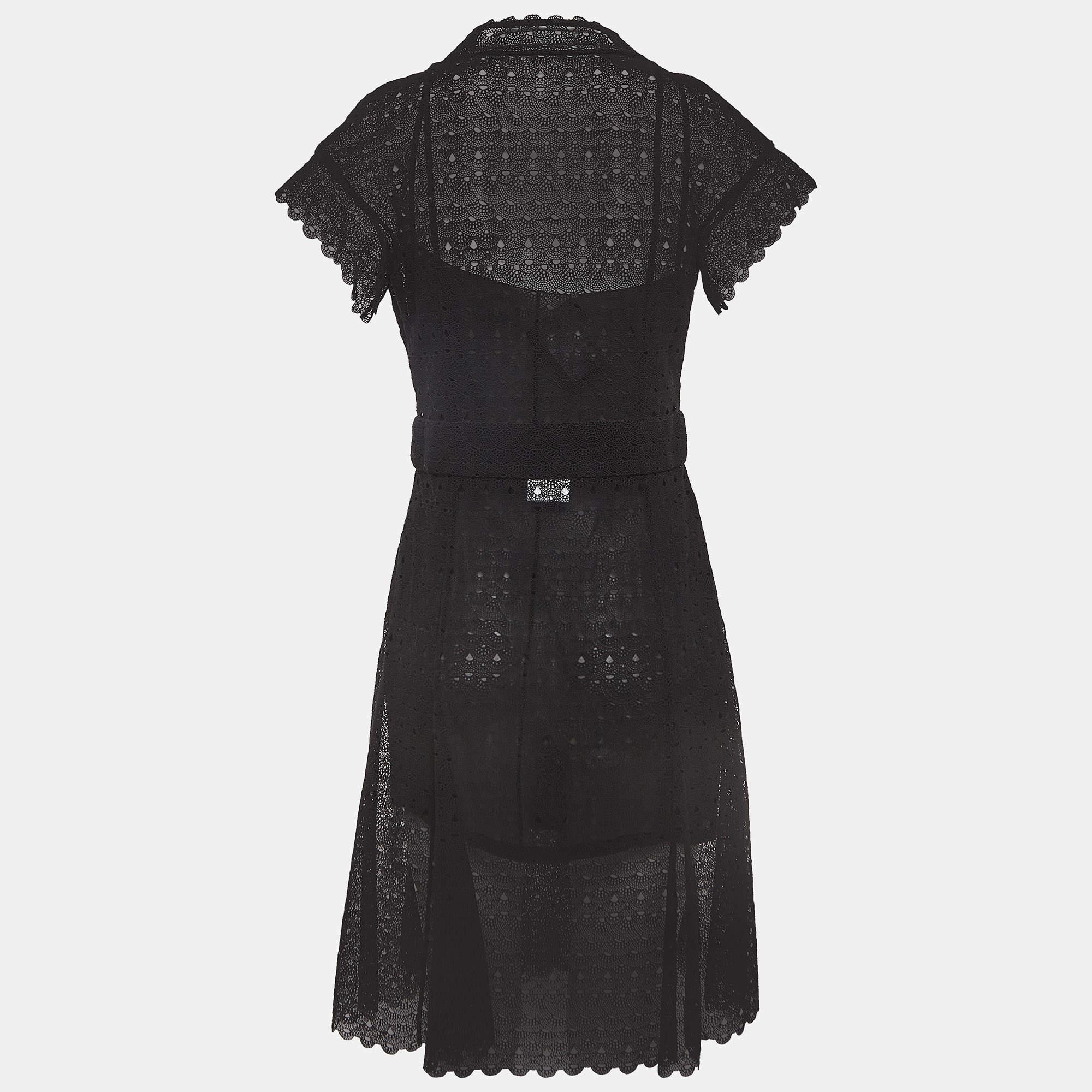 Experience the allure of Chanel's dress. Crafted with meticulous detail, this piece exudes understated charm. Delicate crochet work meets semi-sheer fabric, while button accents add a touch of refinement. Effortlessly chic, it's a timeless addition