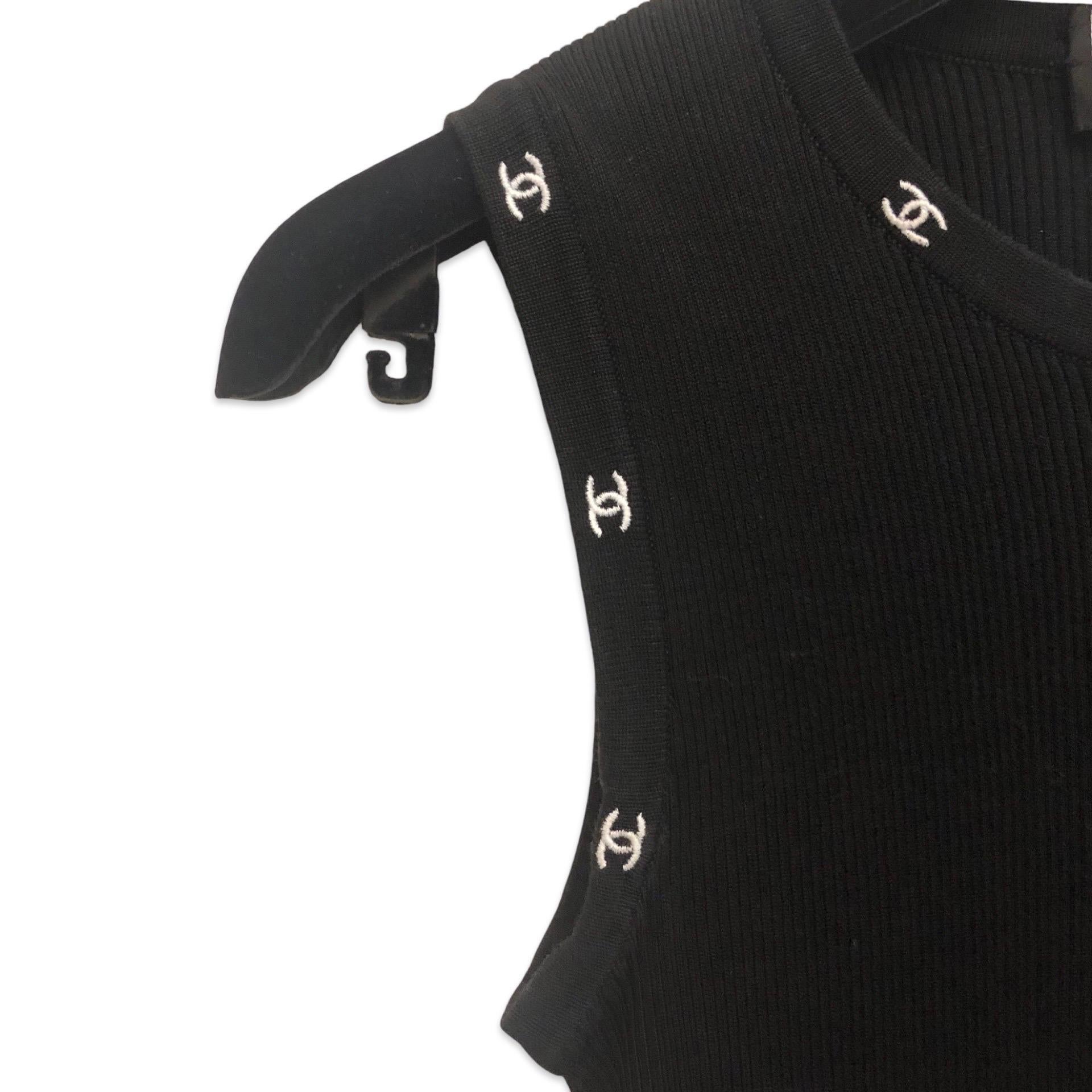 - This black cotton Chanel sleeveless top in embroidered white 